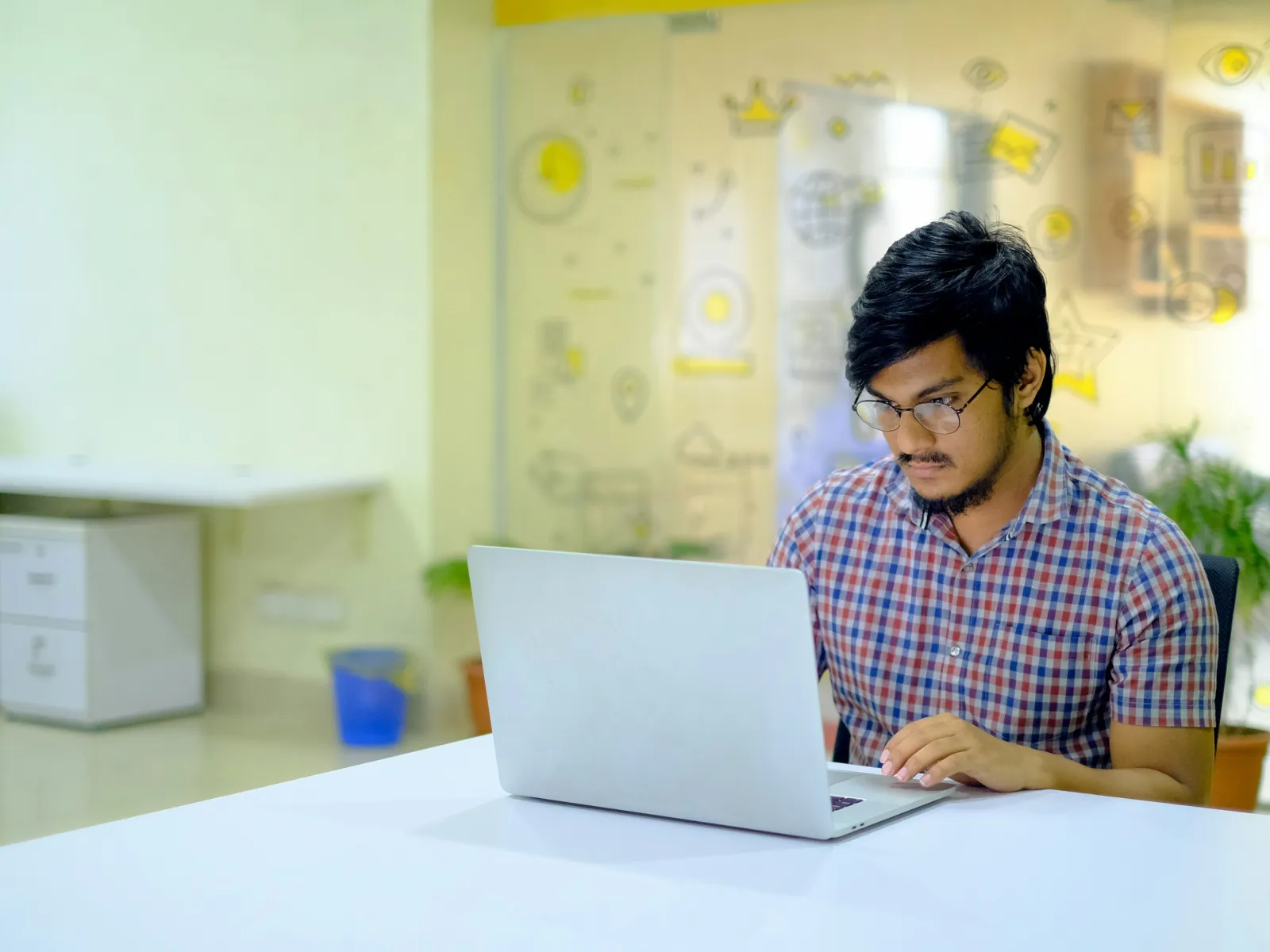 a group of people working on computers