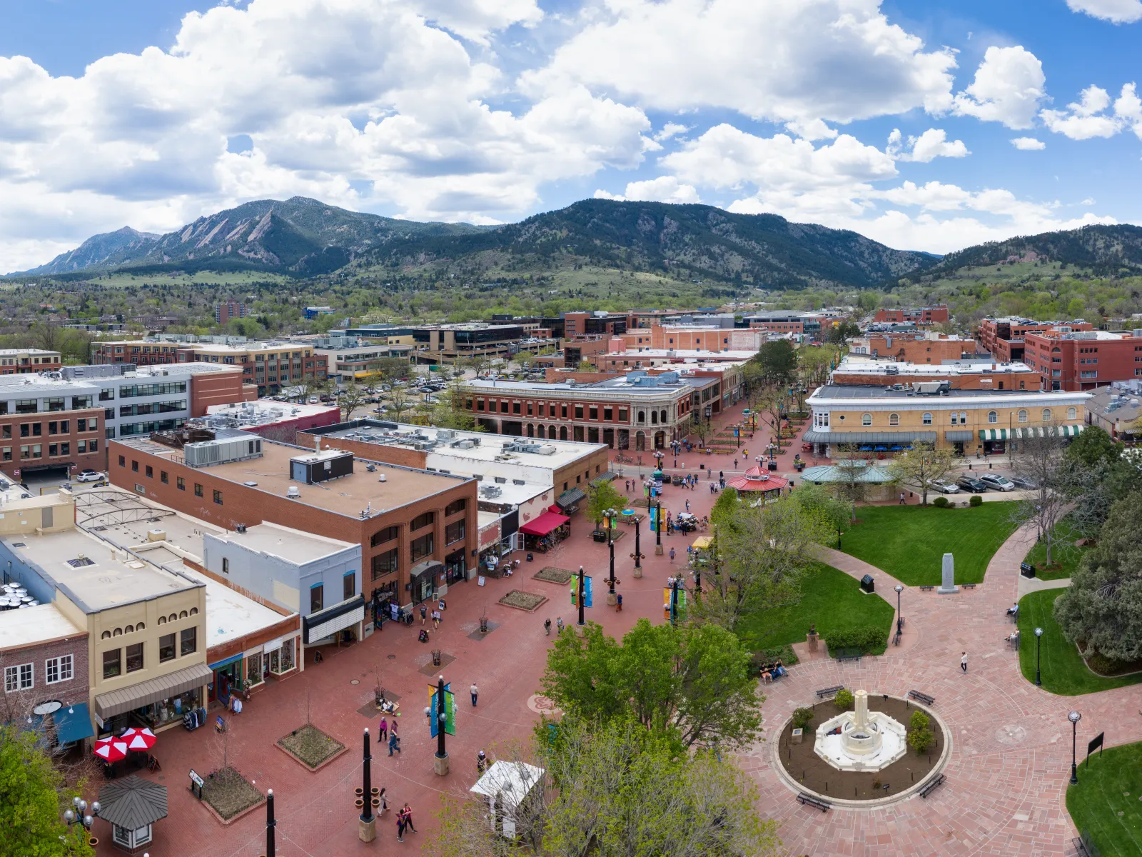 a group of people walking around a town