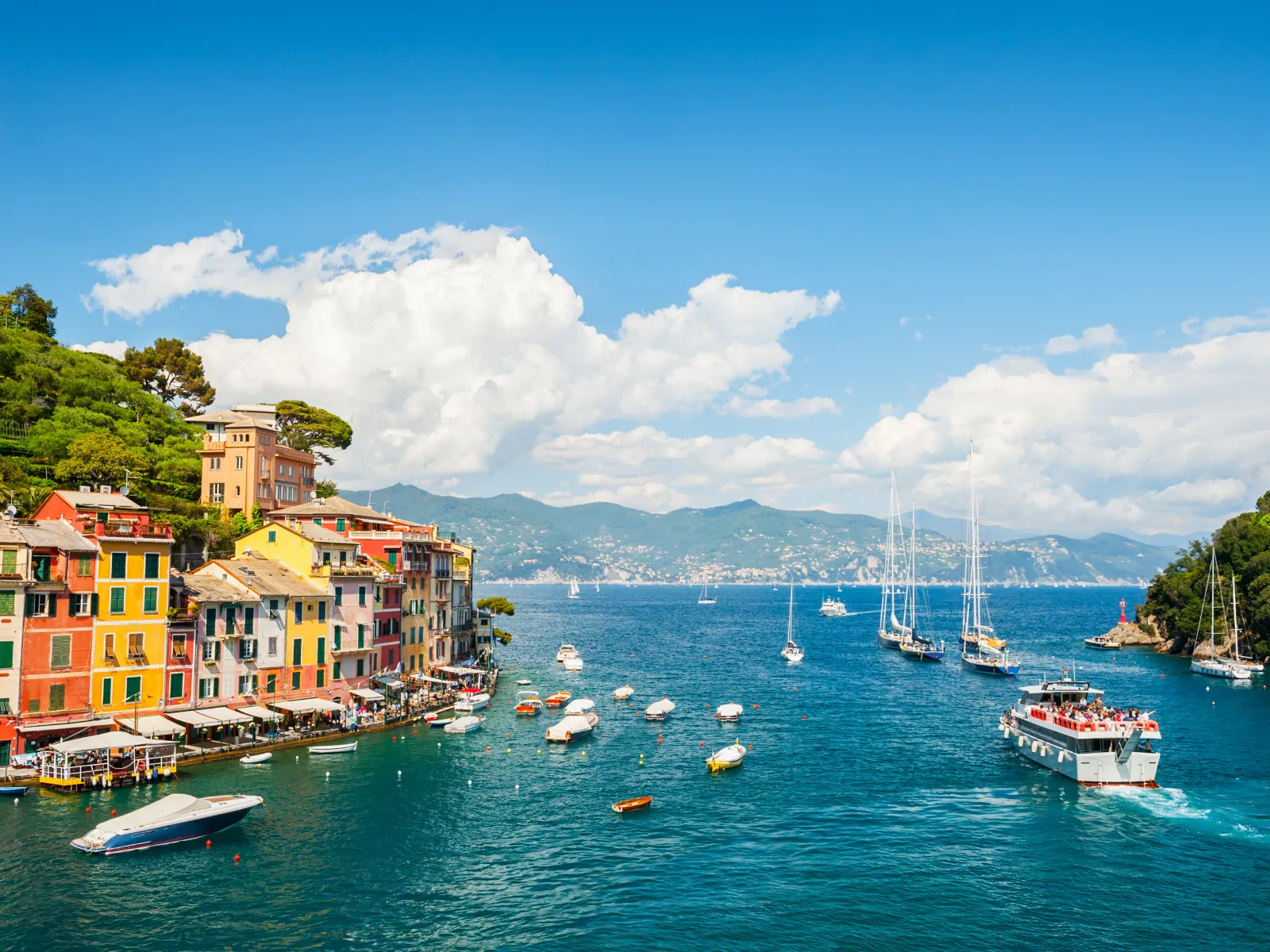 a body of water with boats and buildings along it