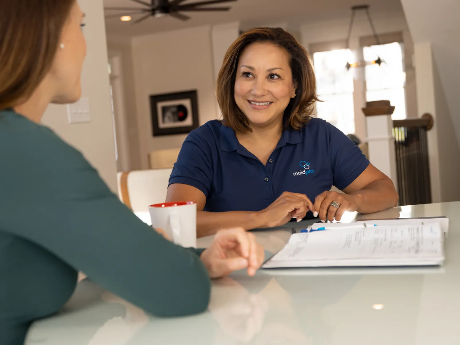 A MaidPro franchisee working with a client