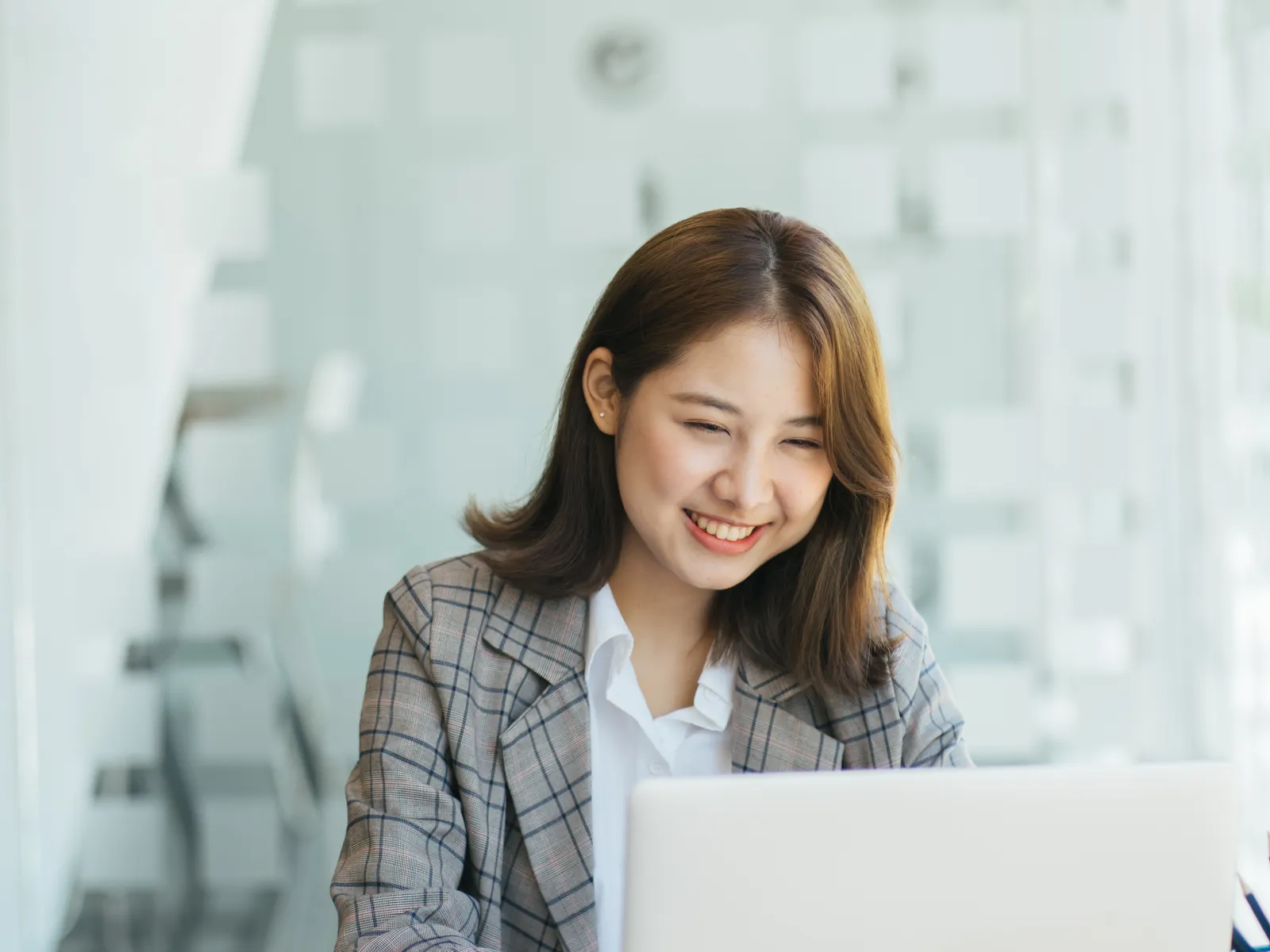 a woman working on her laptop
