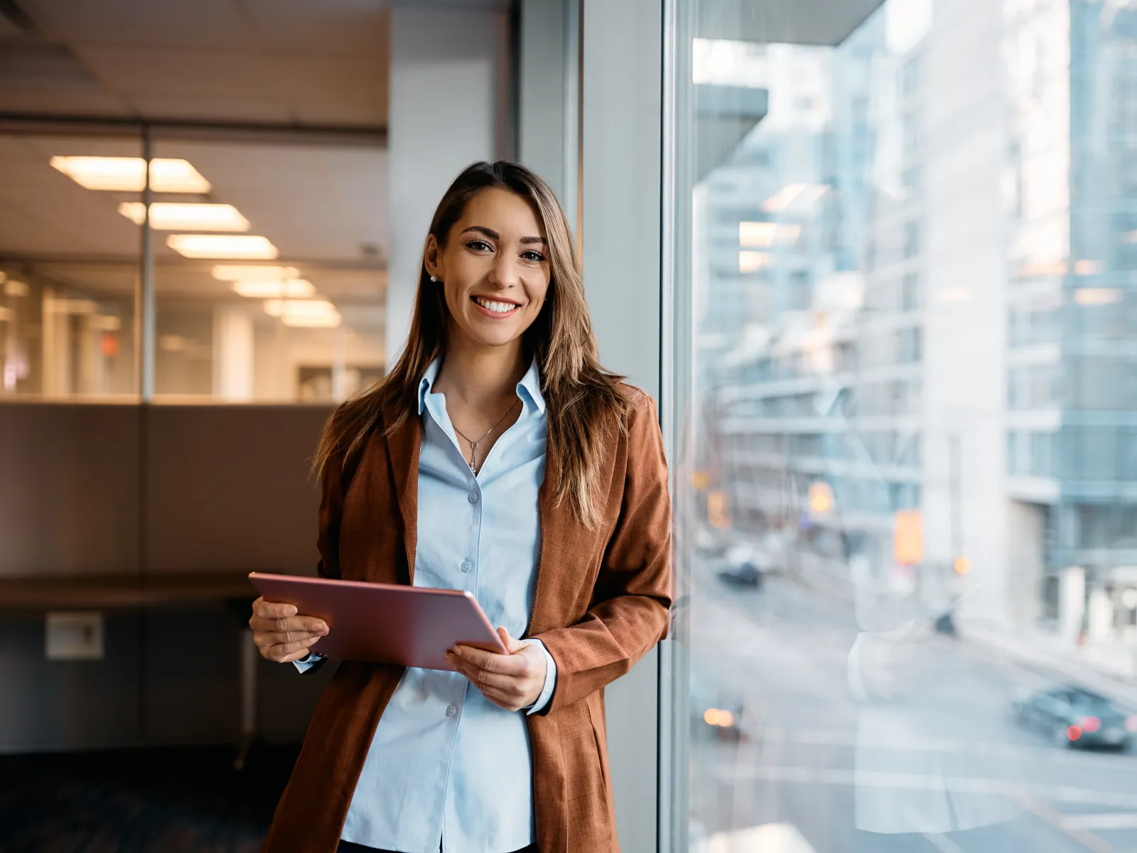 a woman holding a tablet