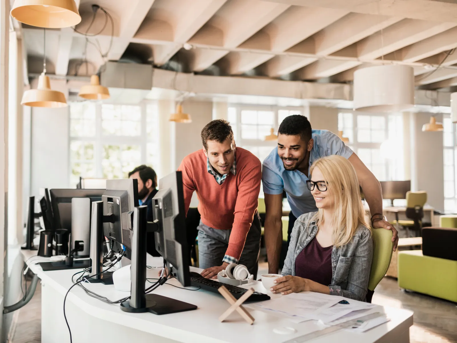 a group of people working in an office