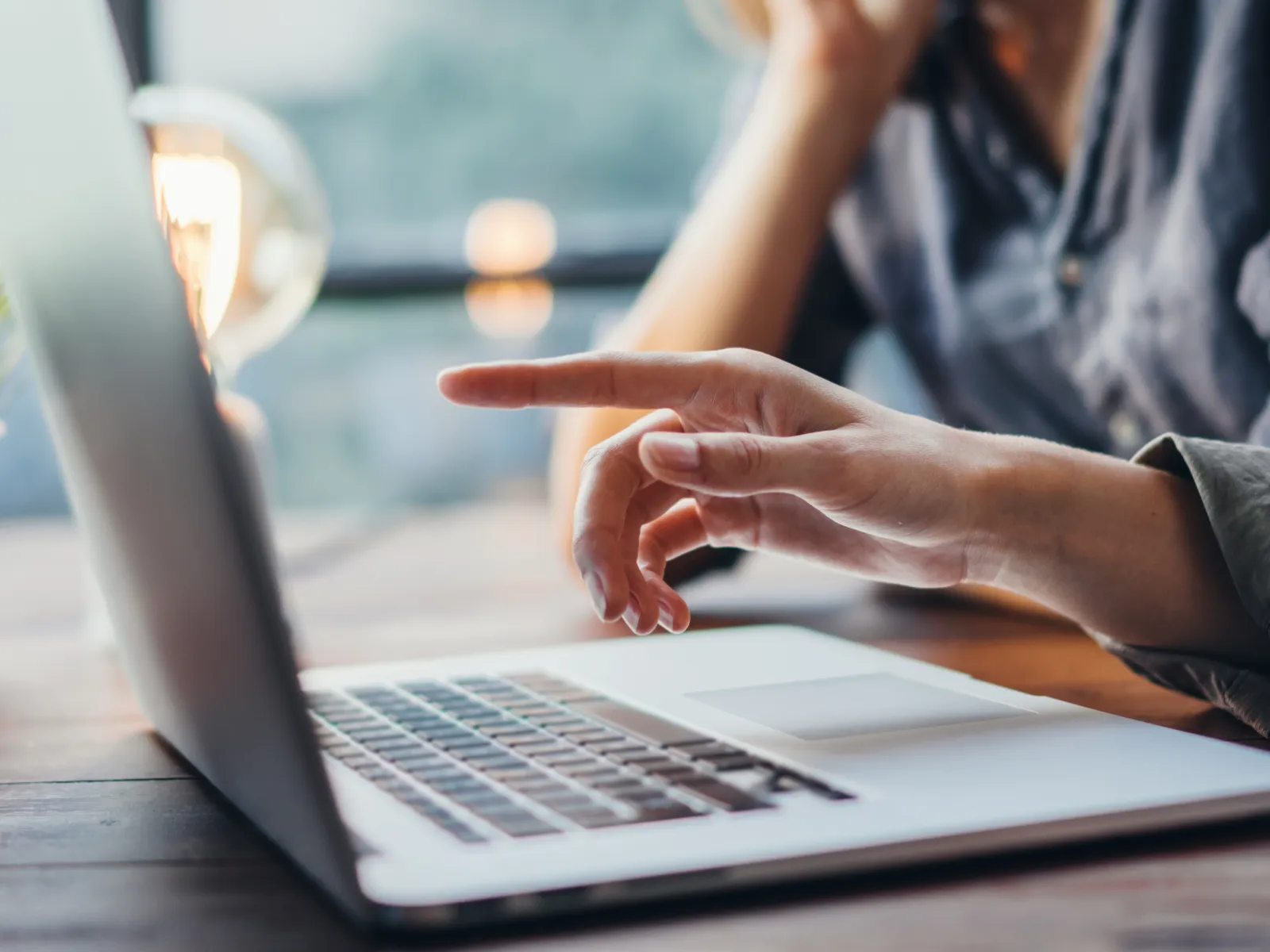 a man and a woman working on a laptop
