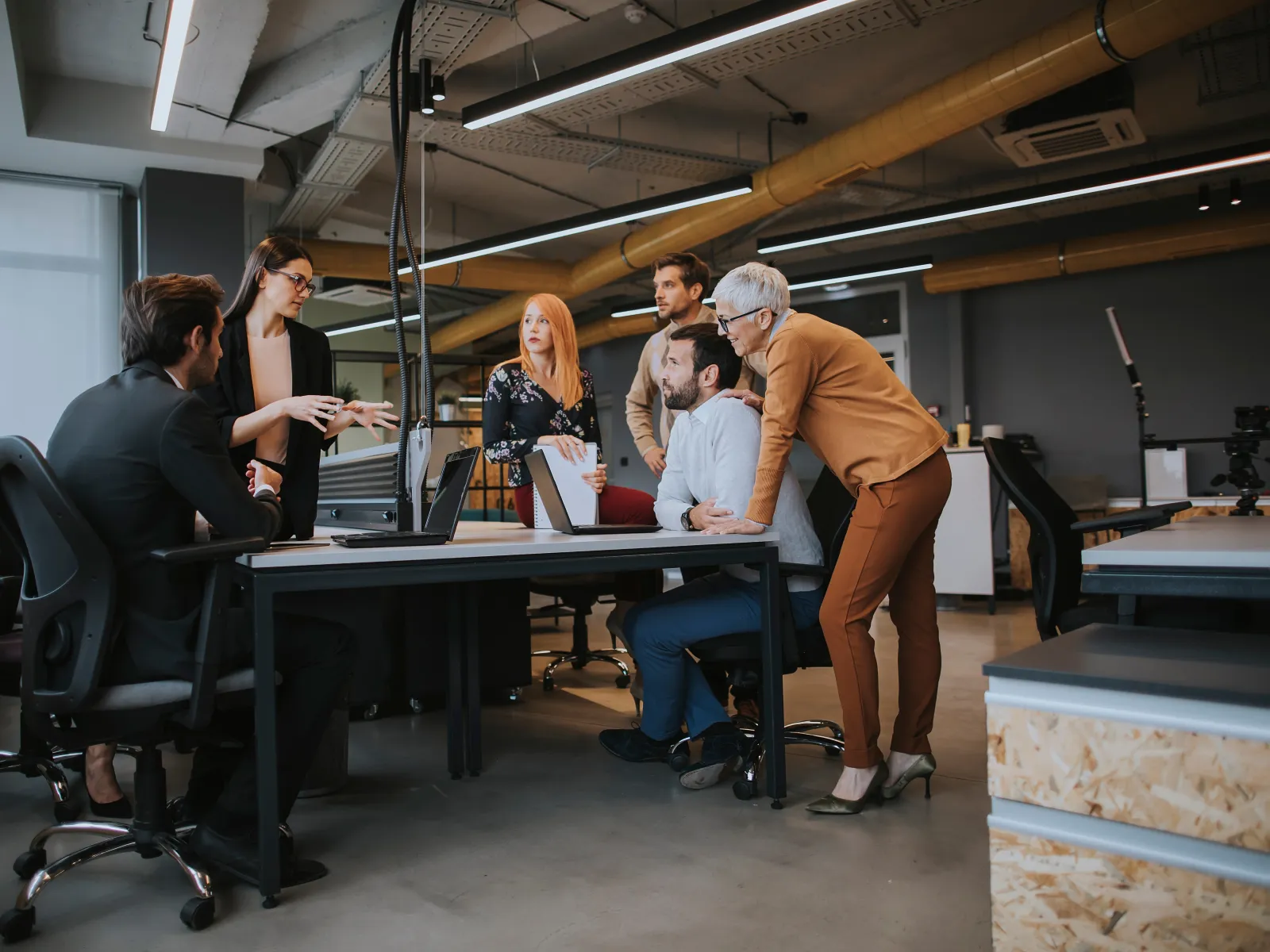 a group of people working in an office