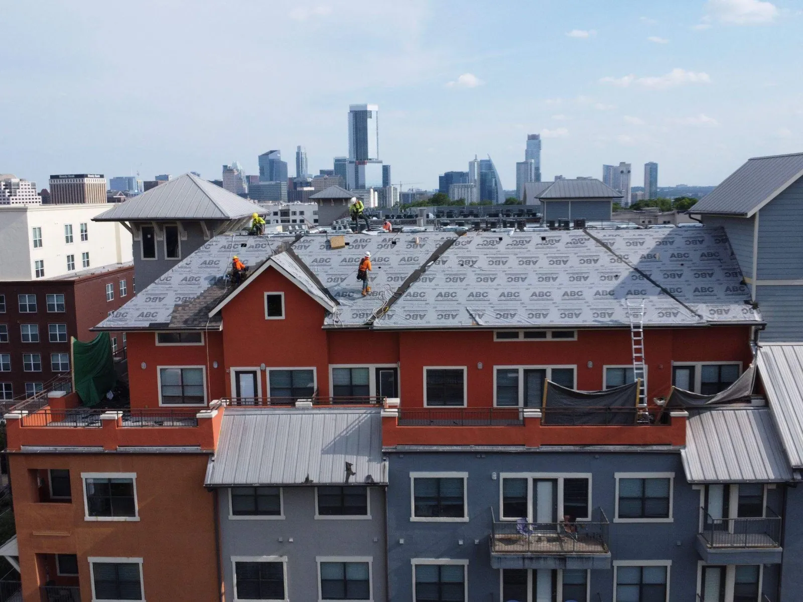a group of buildings with snow on the roofs