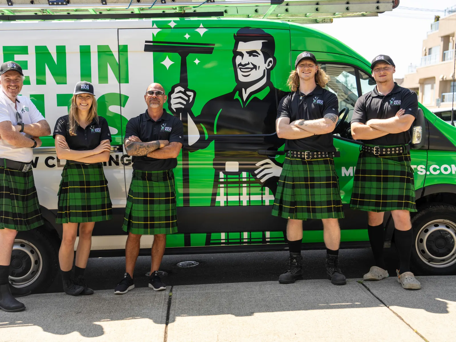 a group of people wearing kilts