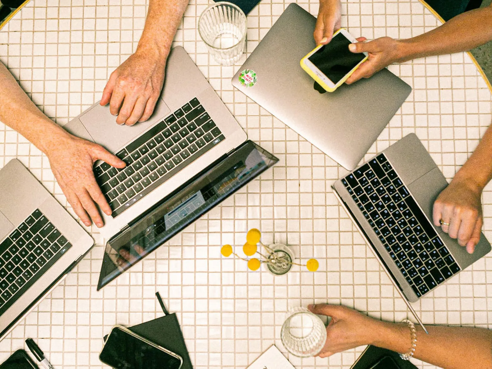 a group of people working on computers