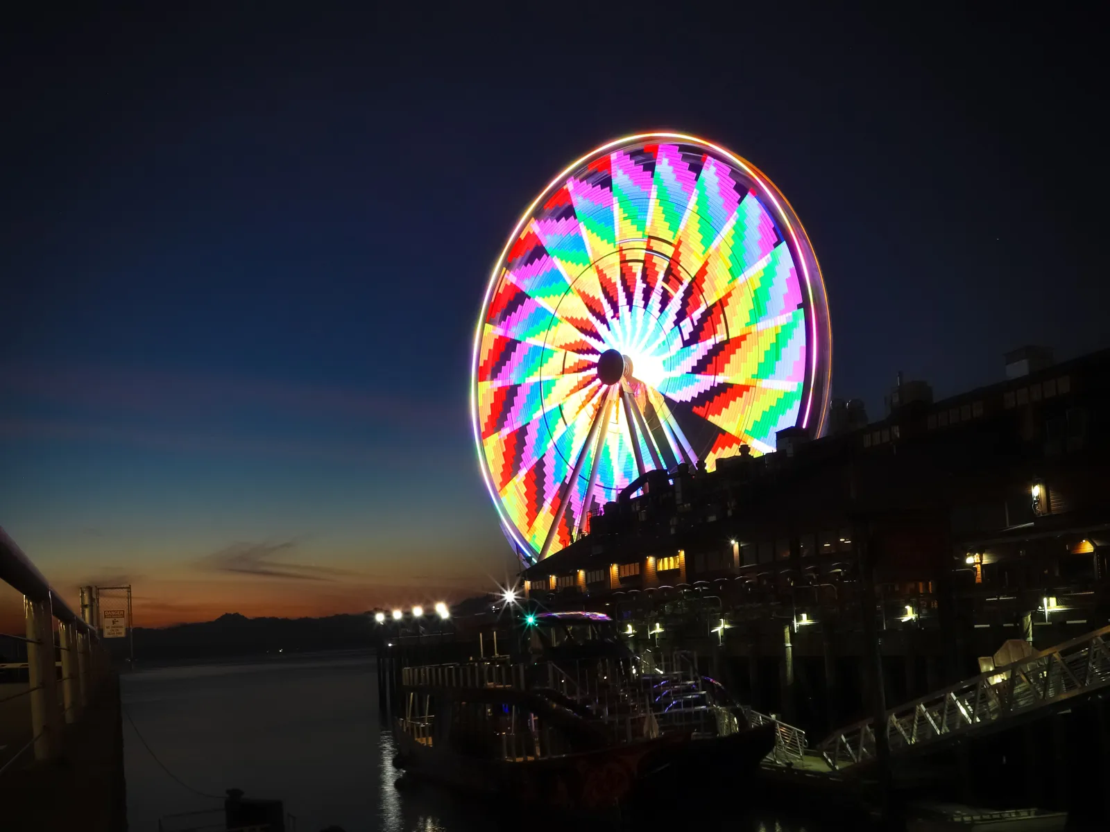 a ferris wheel lit up at night