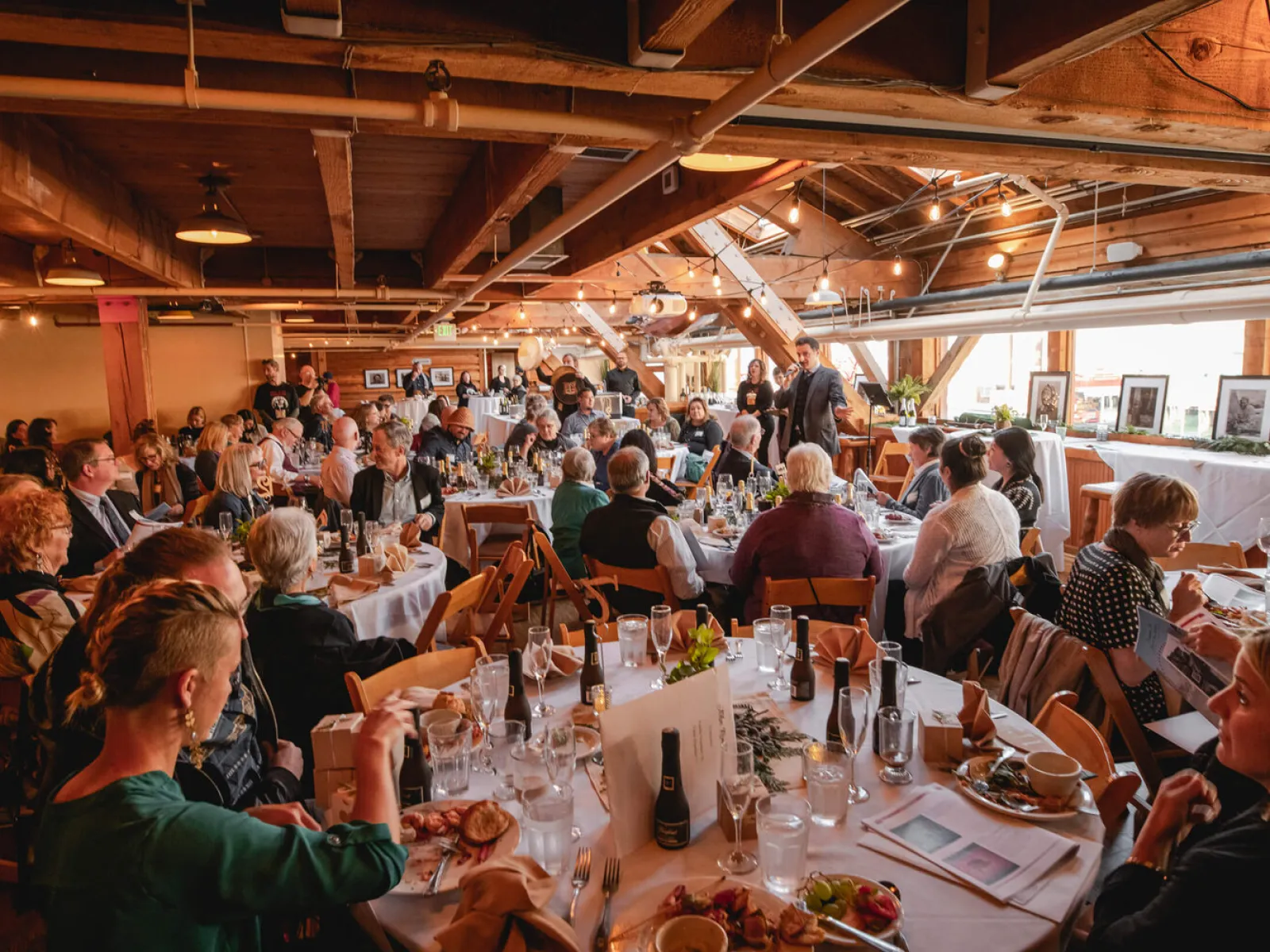 a group of people sitting at a table in a restaurant