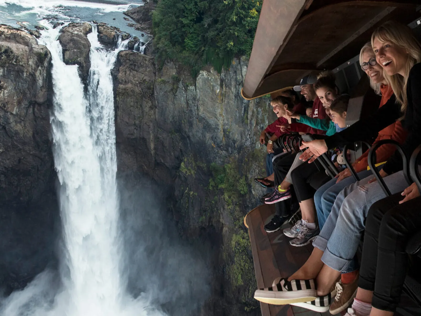 a group of people standing on top of a mountain