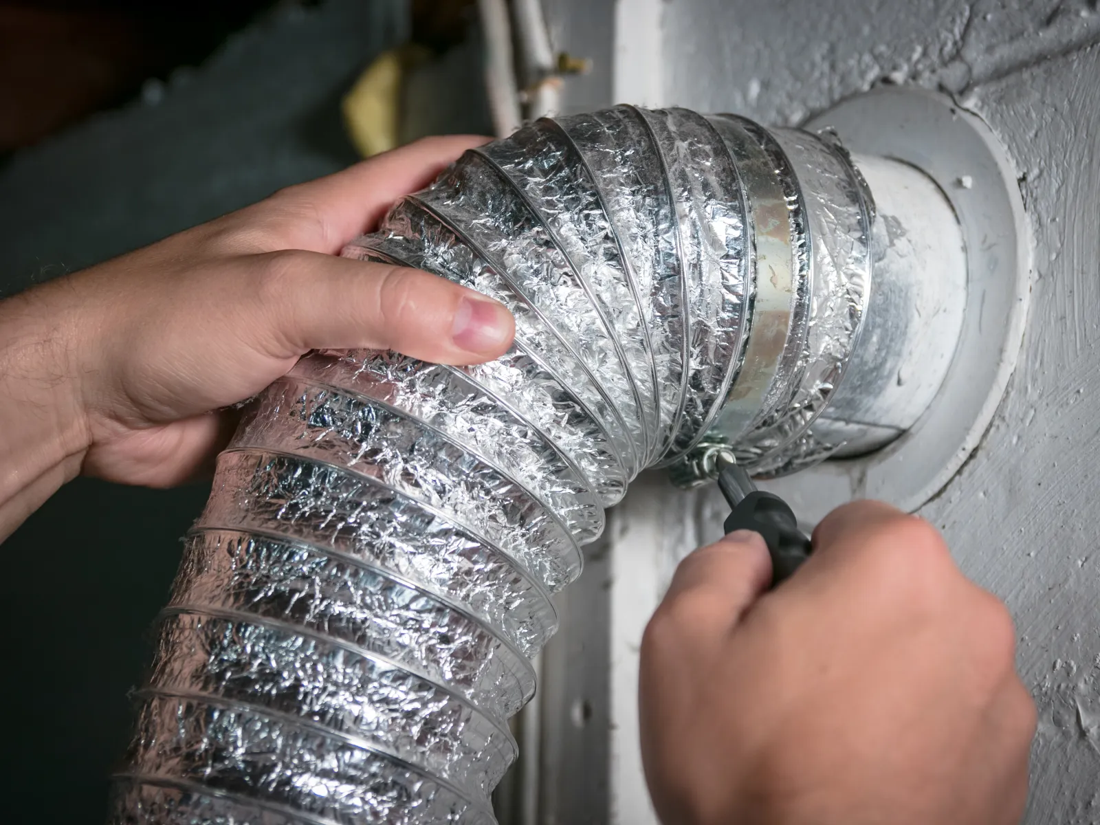 a person holding a metal object