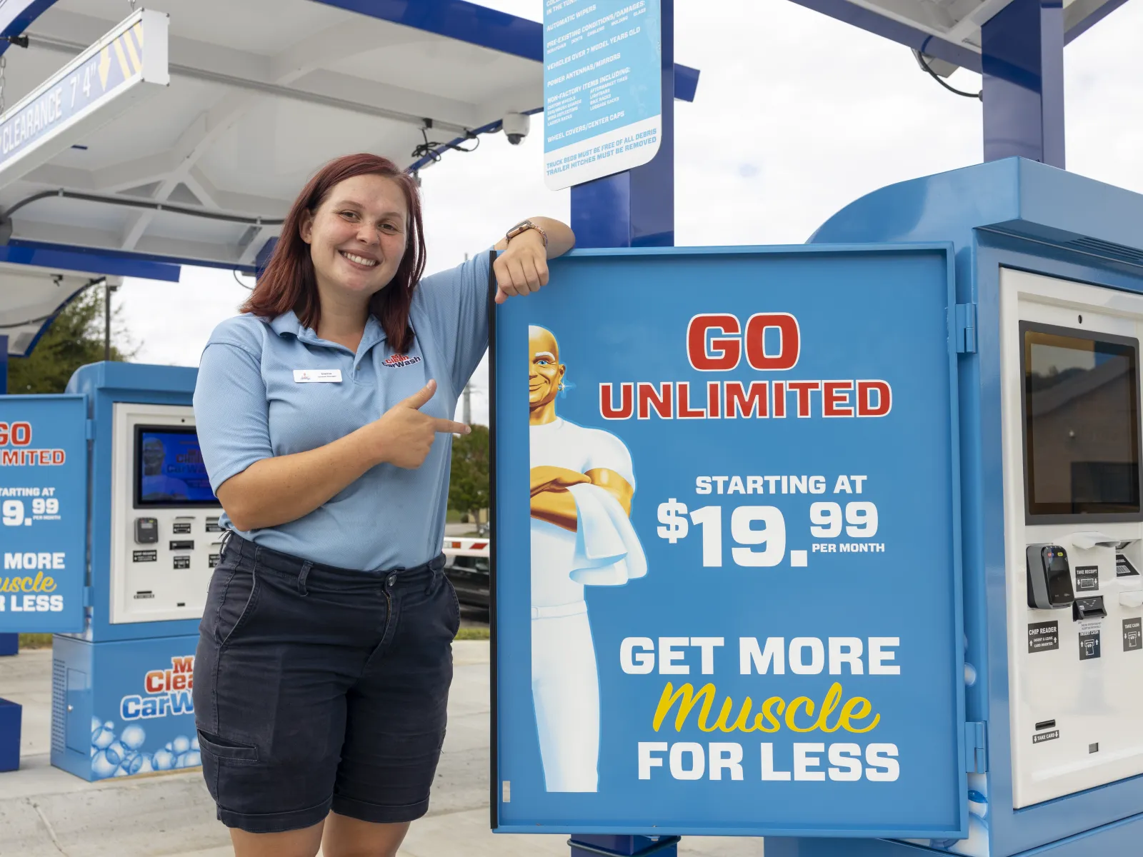a person standing next to a sign