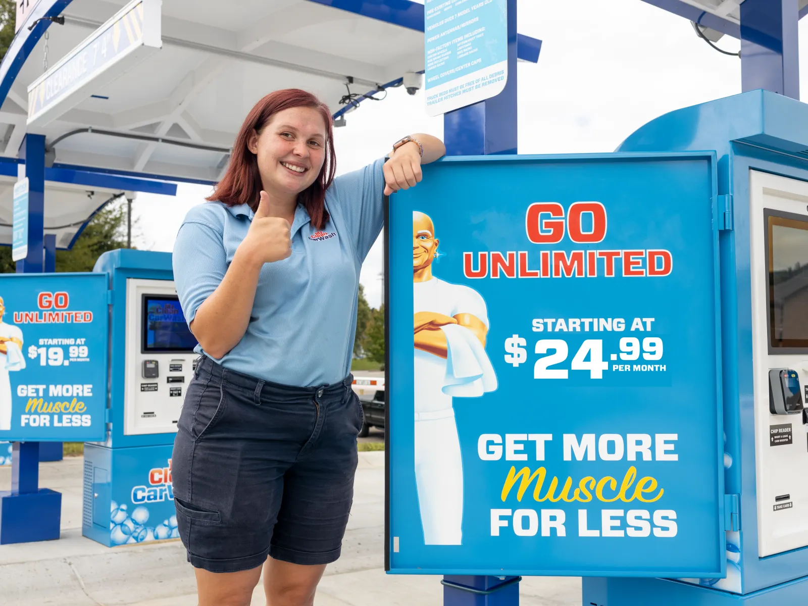 a person standing next to a sign