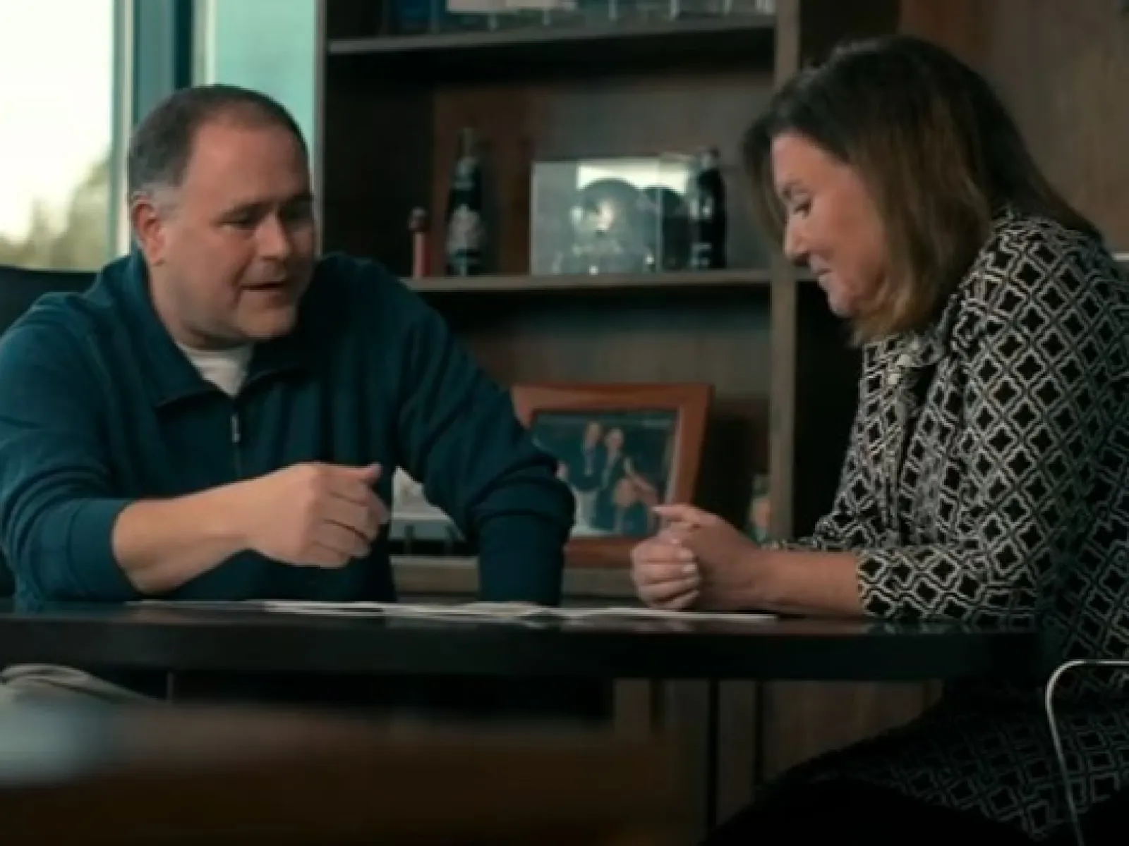 a man and a woman sitting at a table
