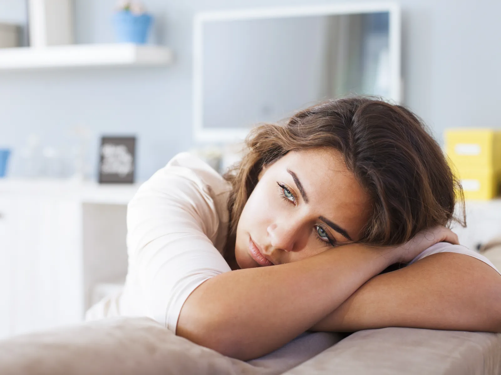 a woman sitting on a bed
