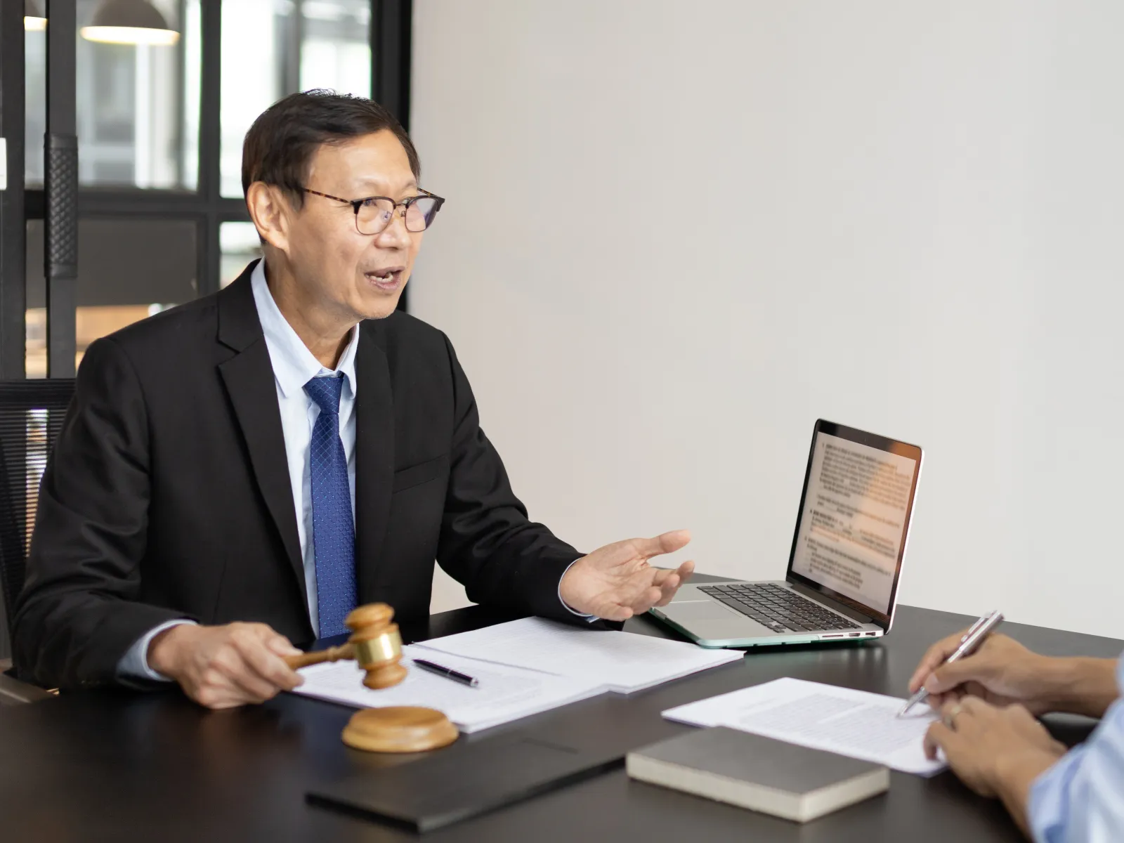 A man asking a lawyer about traditional representation in a divorce.