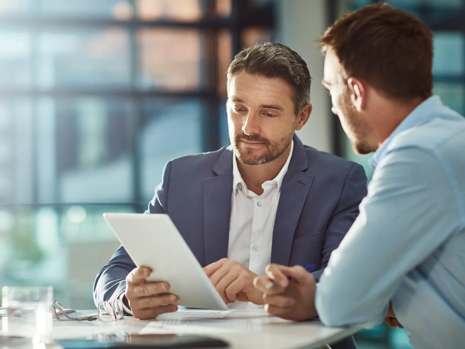 Man with his attorney considering financing his divorce to keep costs down