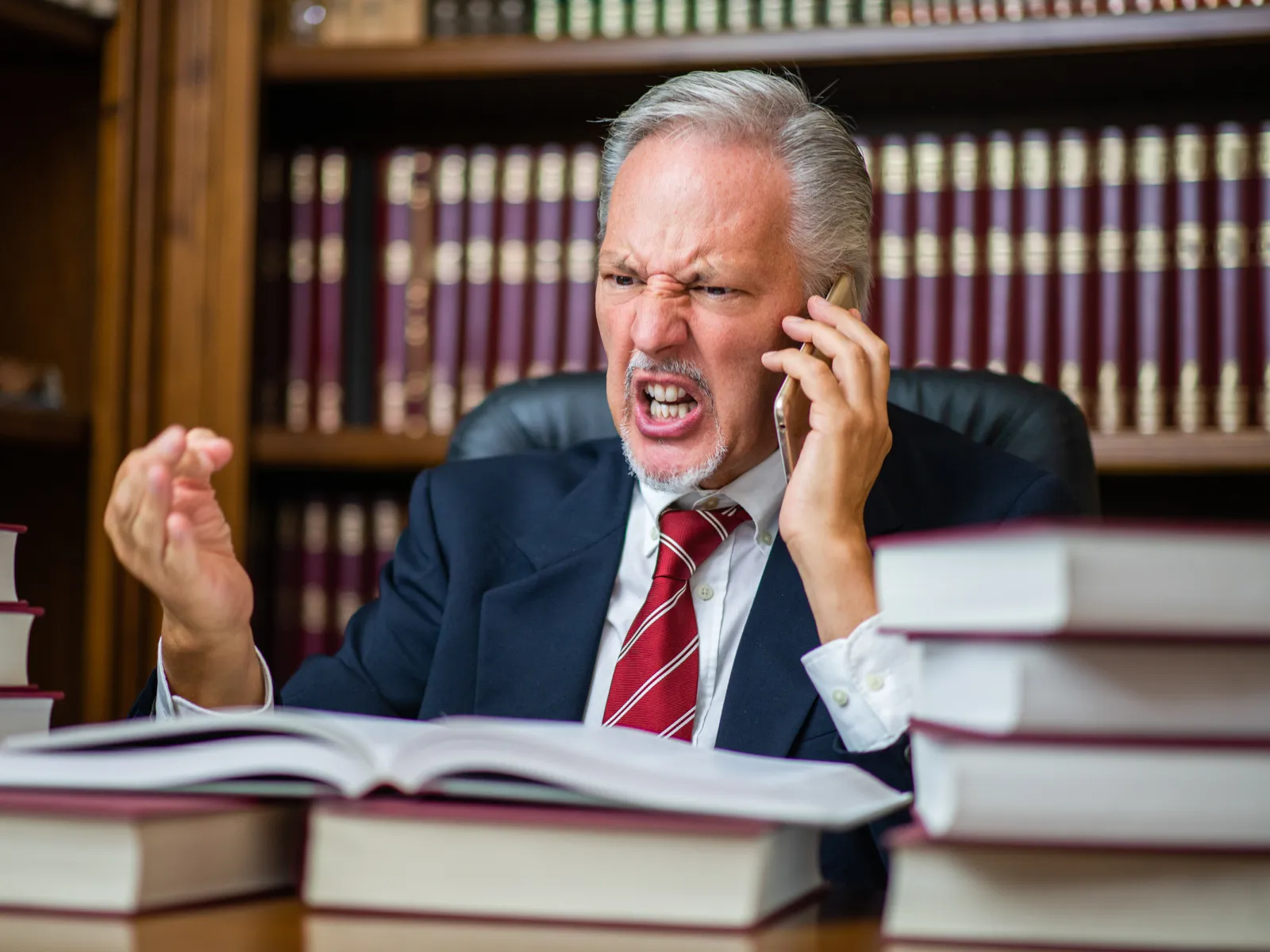 Aggressive divorce lawyer talking on the phone.