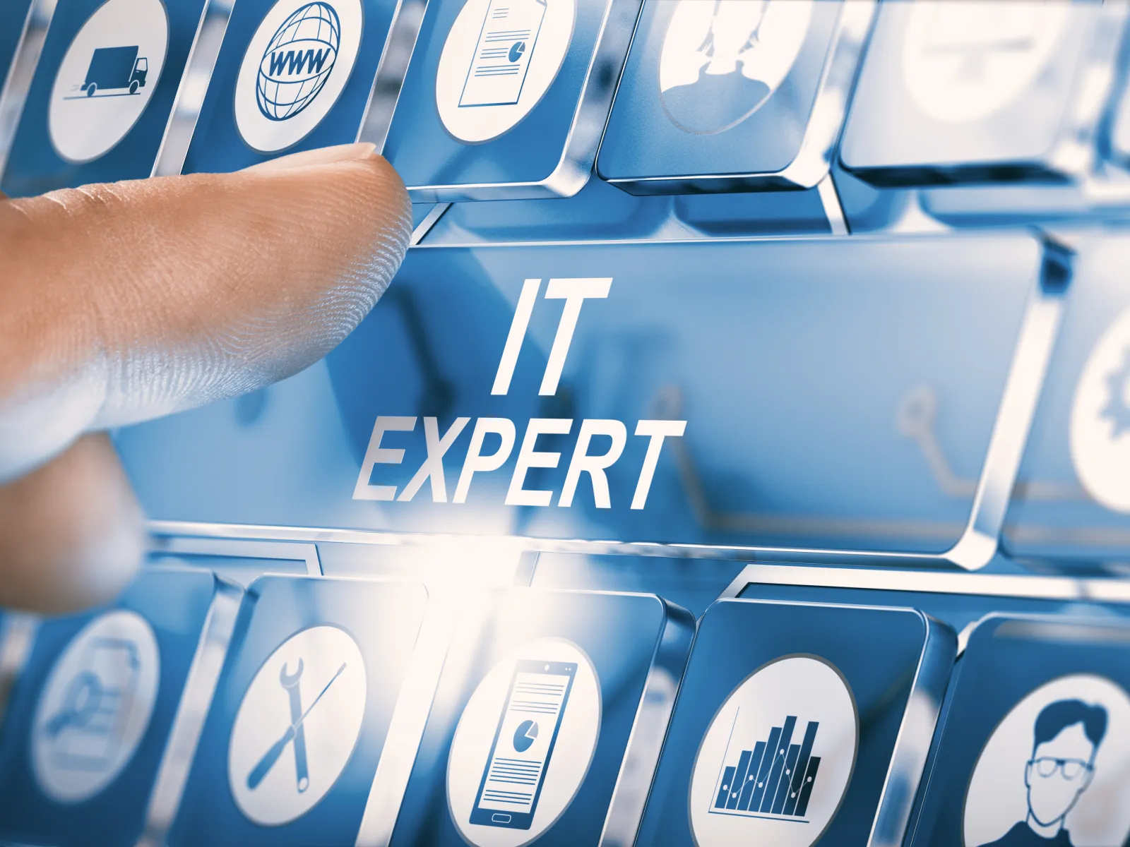 Finger pressing a digital IT Expert key on a futuristic virtual keyboard with tech icons surrounding it.