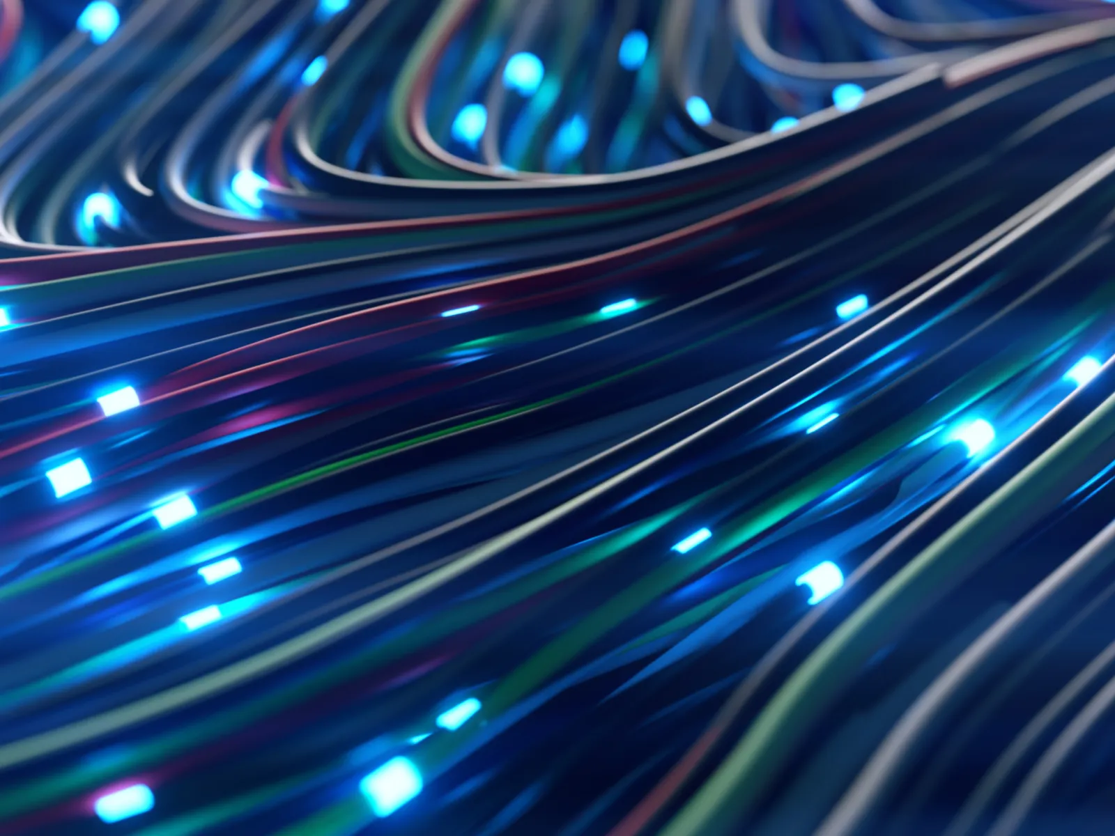 Technician working on a server rack with glowing LEDs and network cables in a data center.
