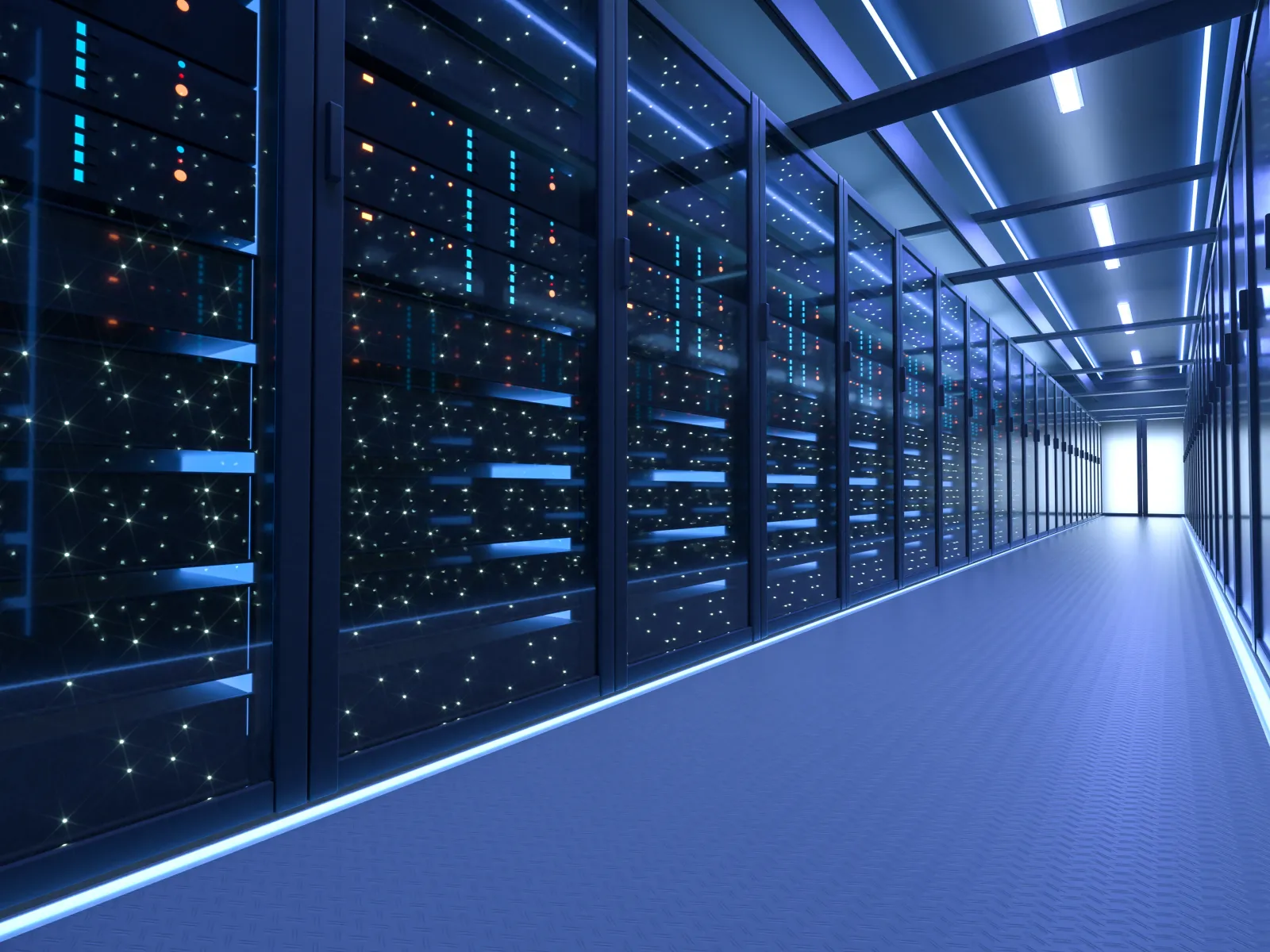 Long corridor of a high-tech data center with illuminated servers behind glass walls in blue lighting.