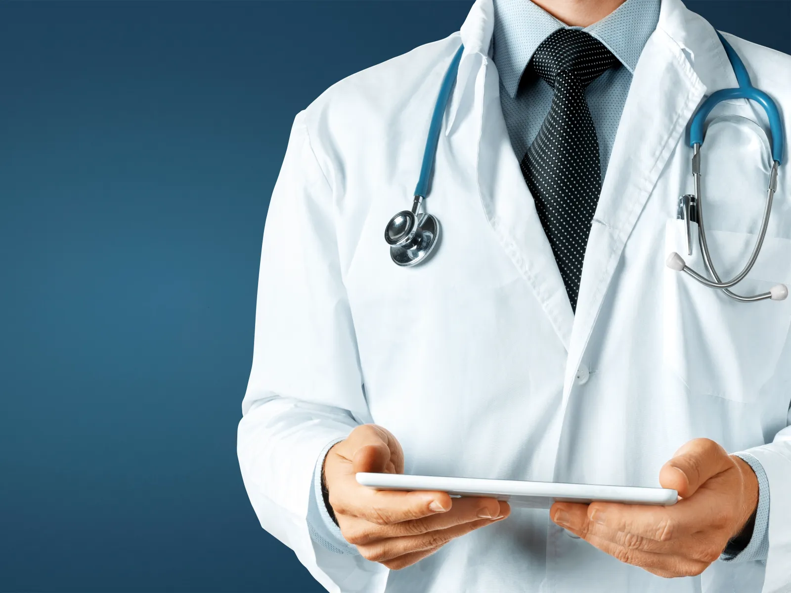 a doctor holding a tablet