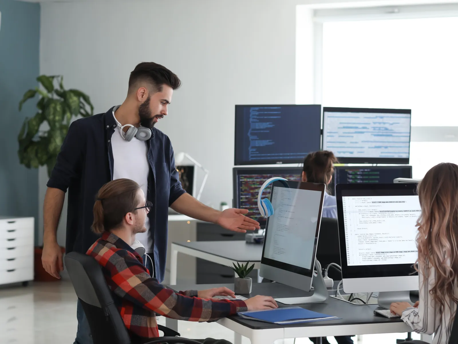 a man showing a woman something on the computer