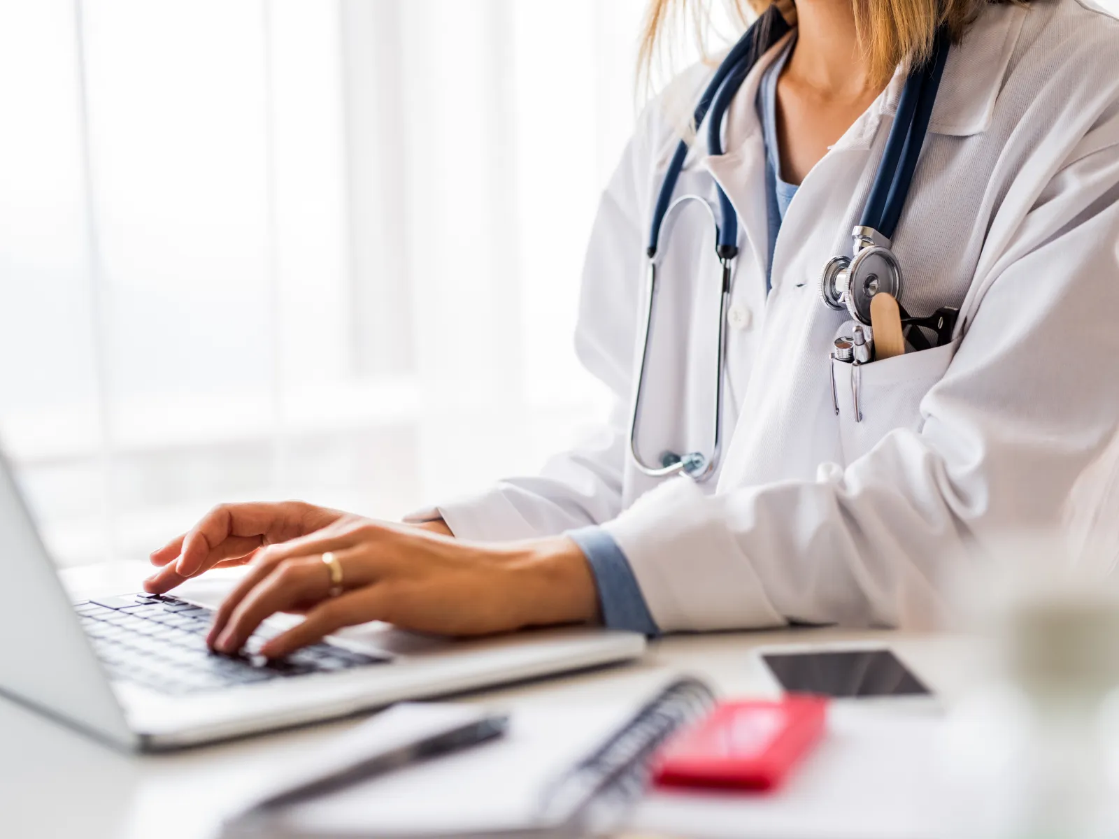 a doctor using a laptop