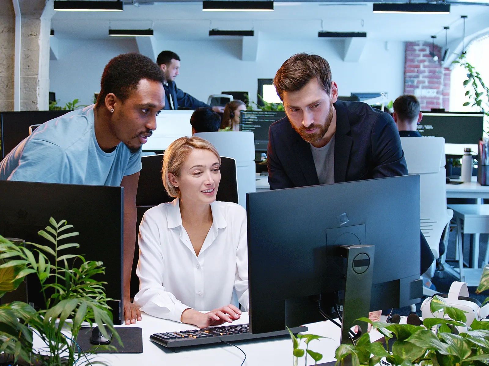 a group of people working in an office