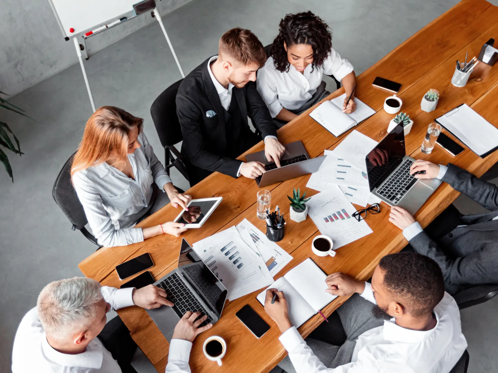 a group of people sitting around a table