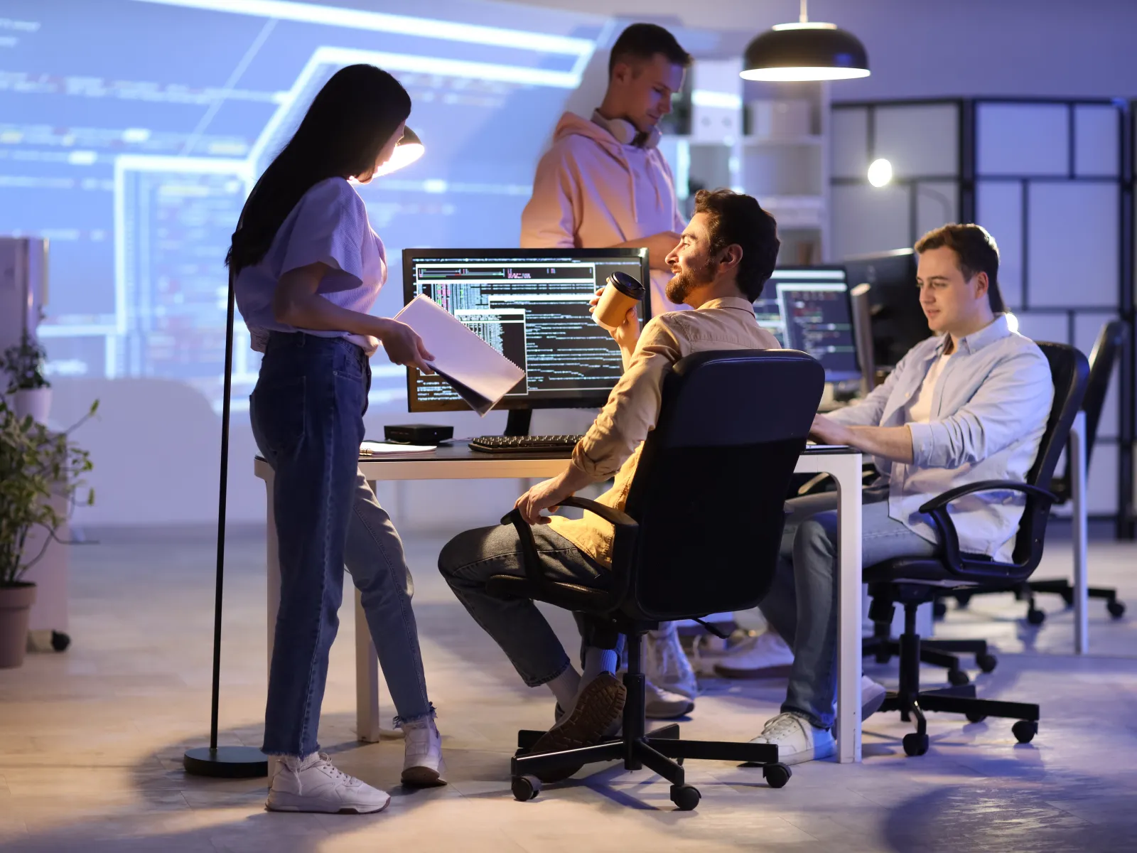 a group of people working on computers