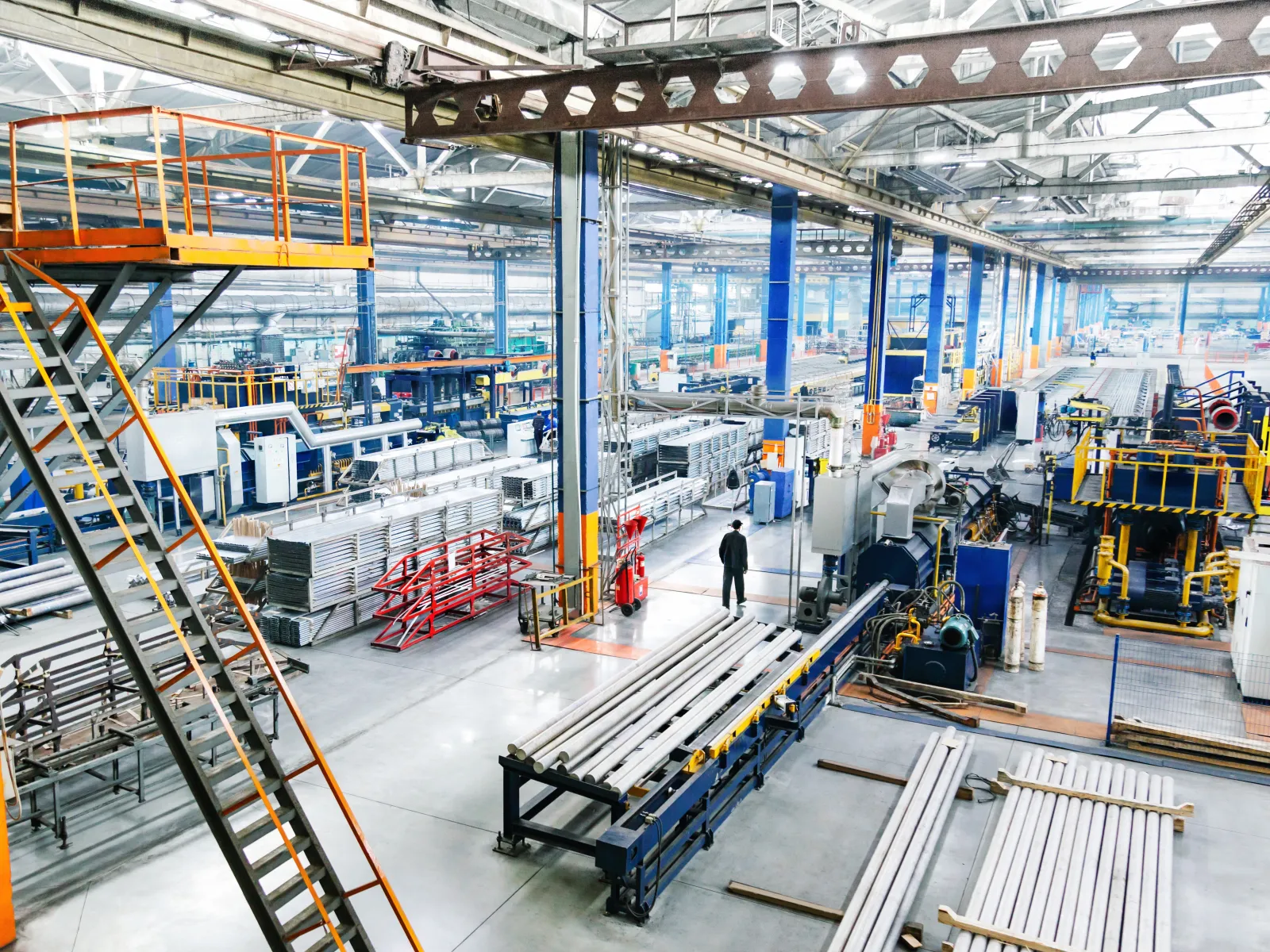 A wide view of a modern manufacturing facility with equipment and production lines.