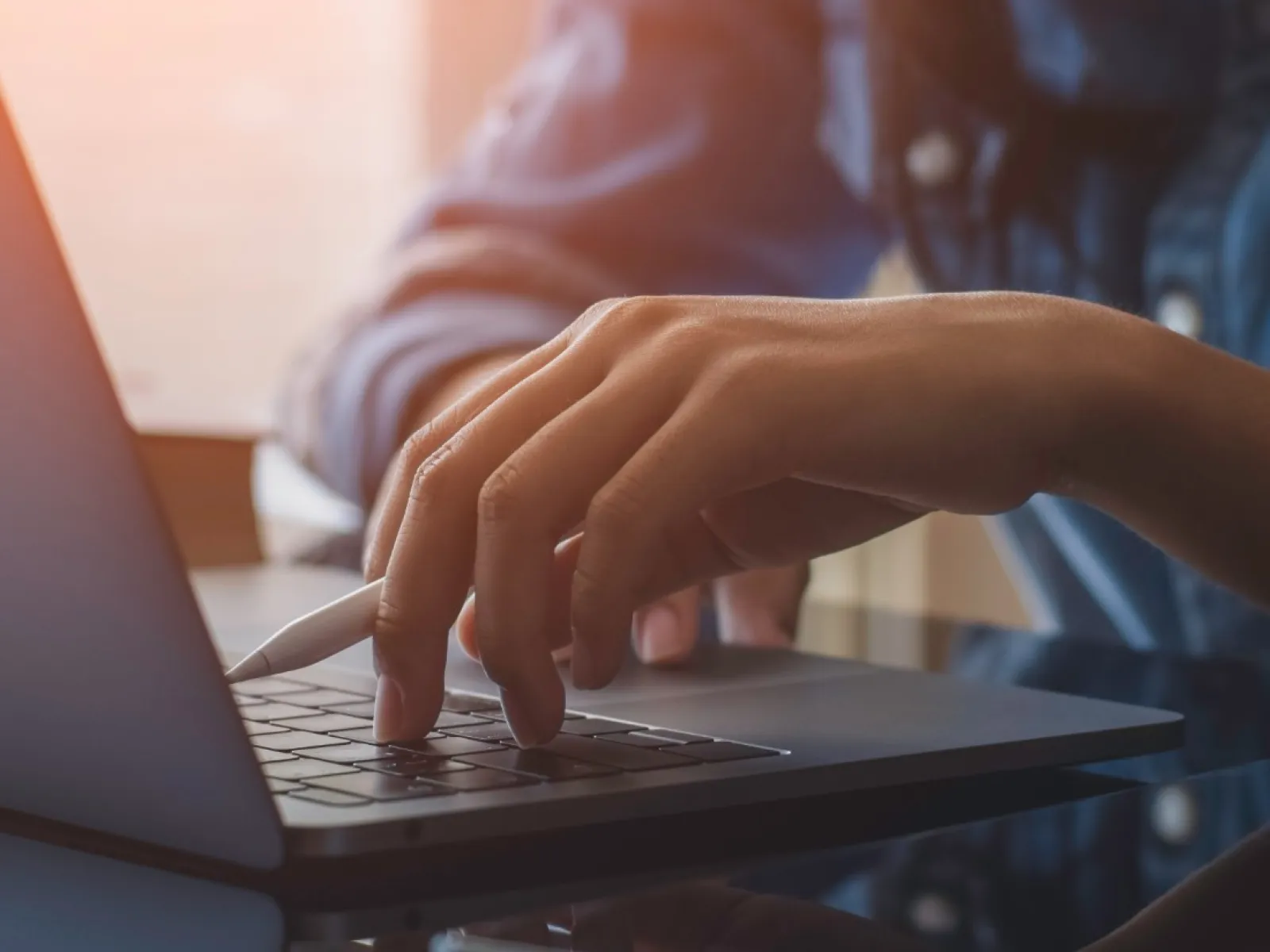 a person typing on a laptop