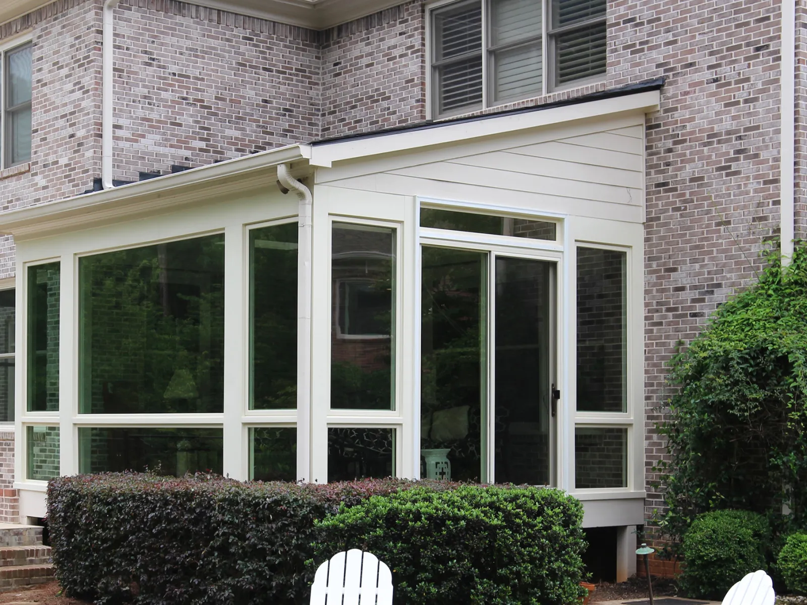 a brick building with a large glass window