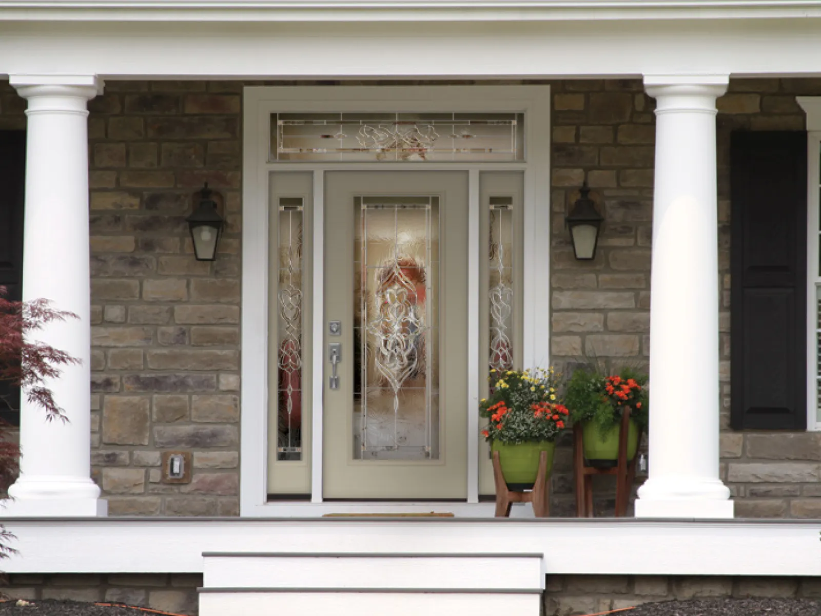 a door with pillars and a window