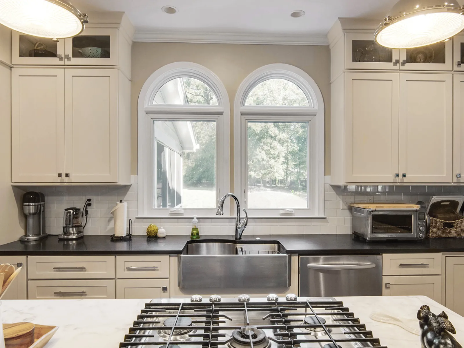 a kitchen with white cabinets