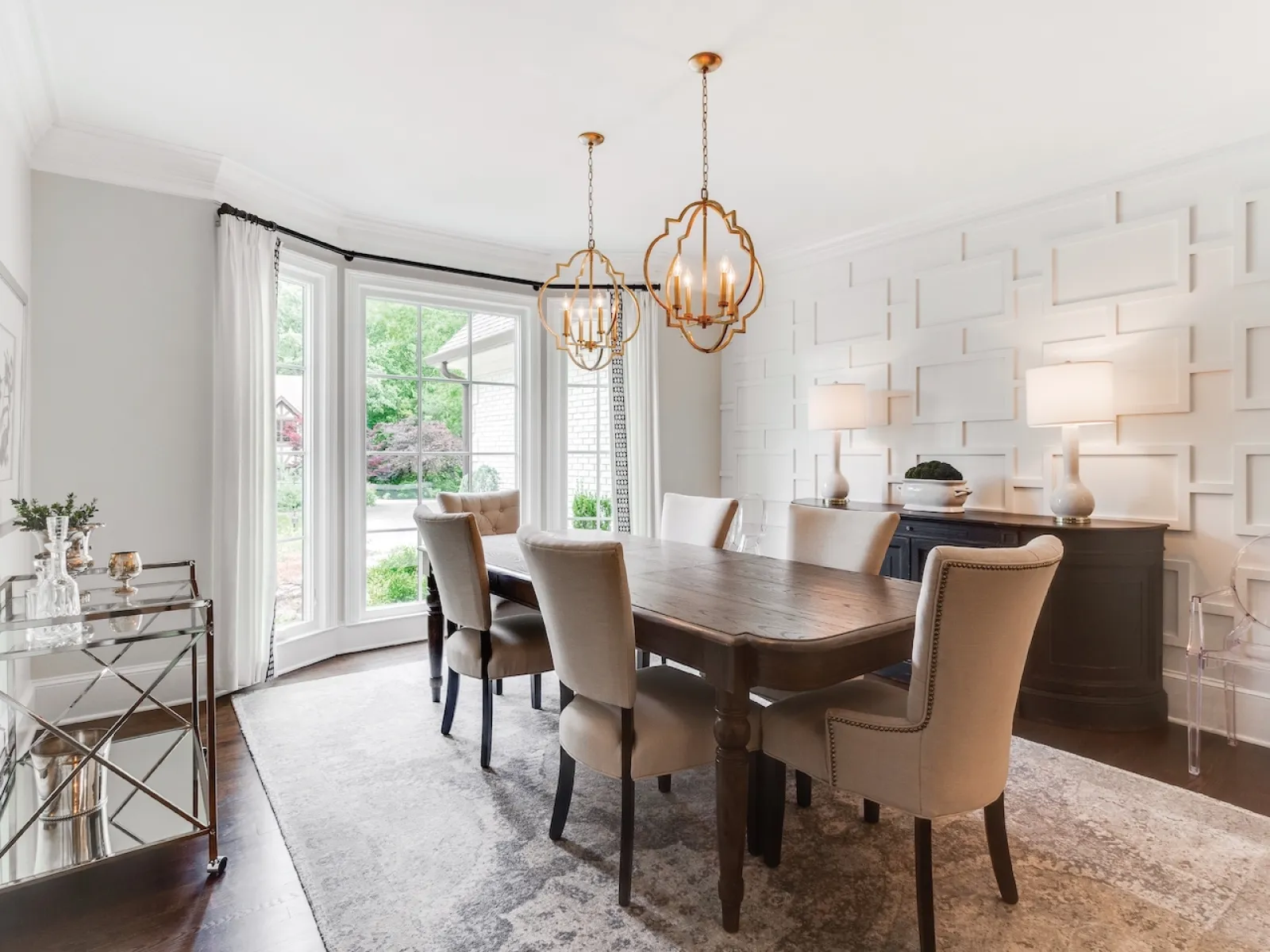 a dining room with a chandelier and a table