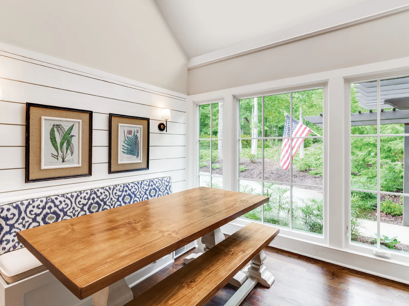 a room with a table and windows