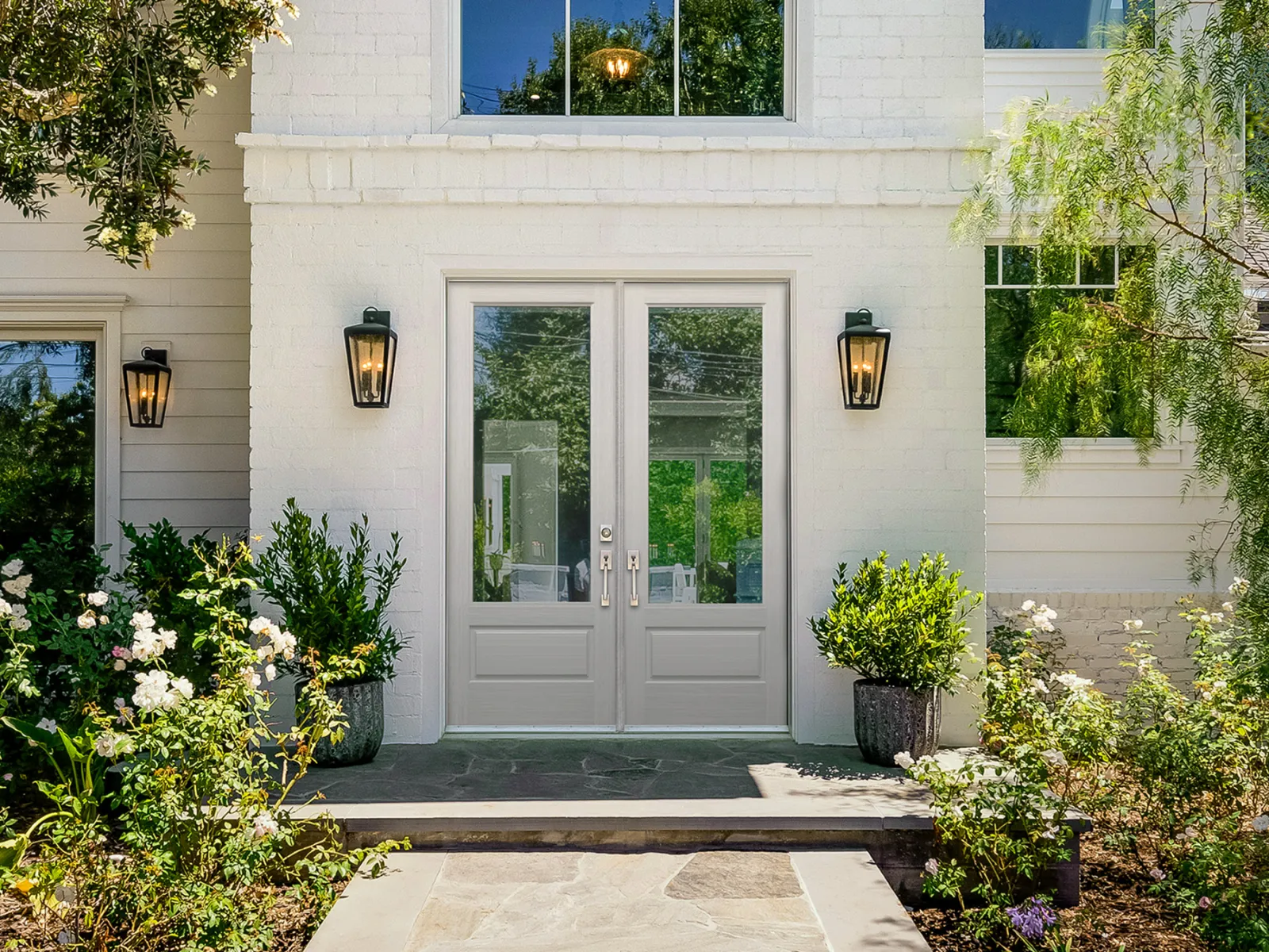 White contemporary house with double front doors from Plastpro and installed by our experienced team