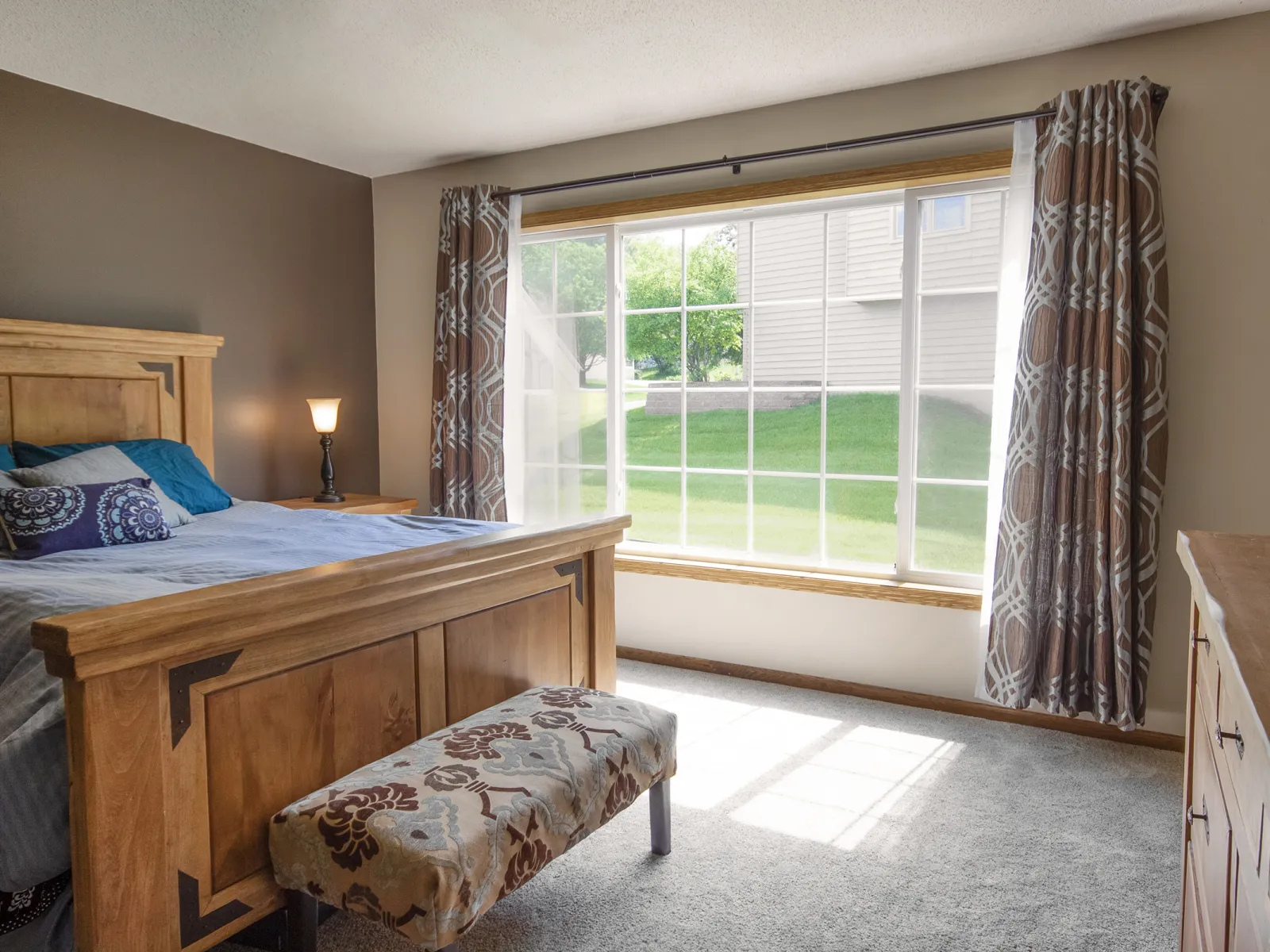 a bedroom with a large window