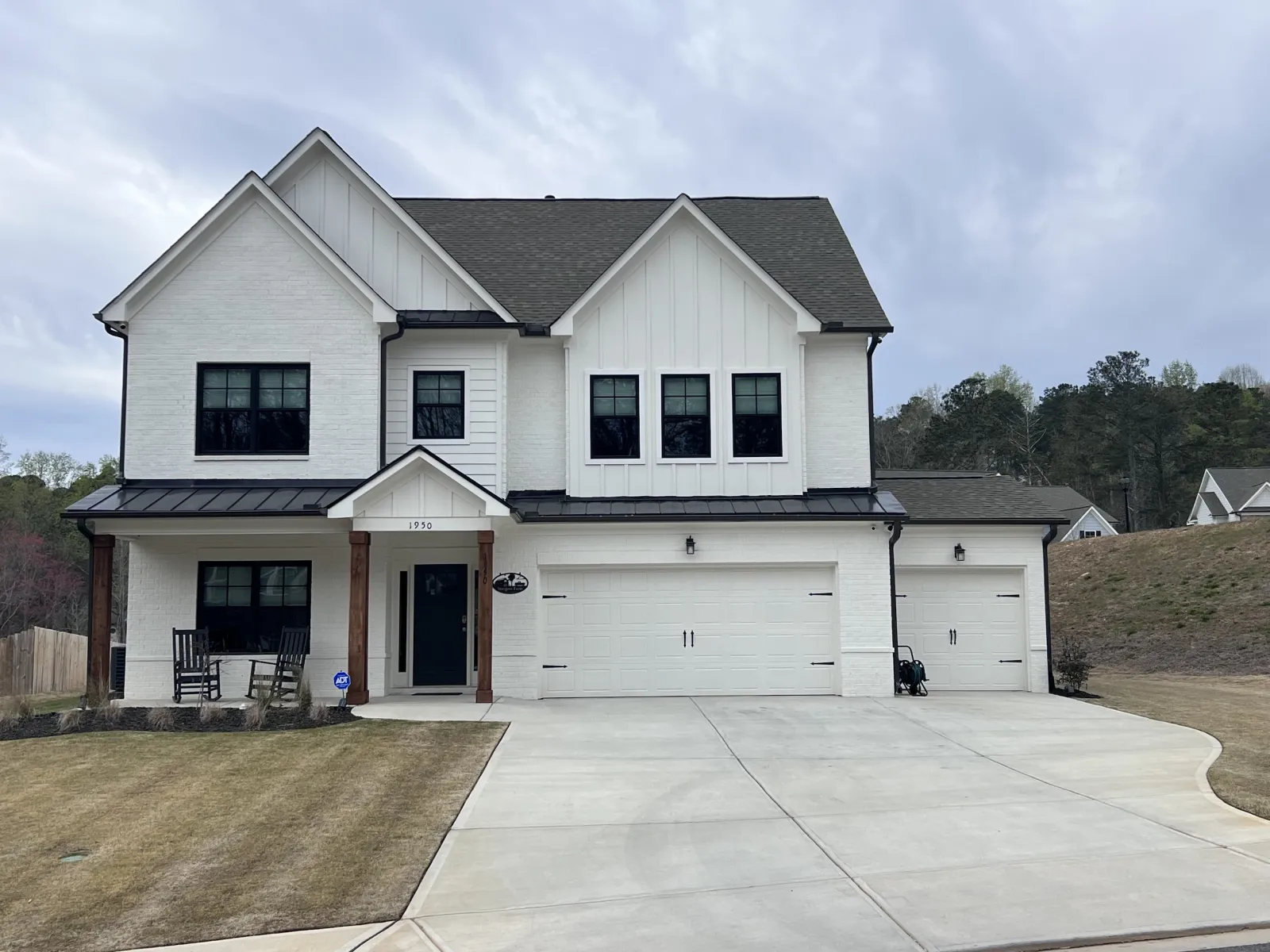 A large white house with replacement windows from the expert window installers at North Georgia Replacement Windows