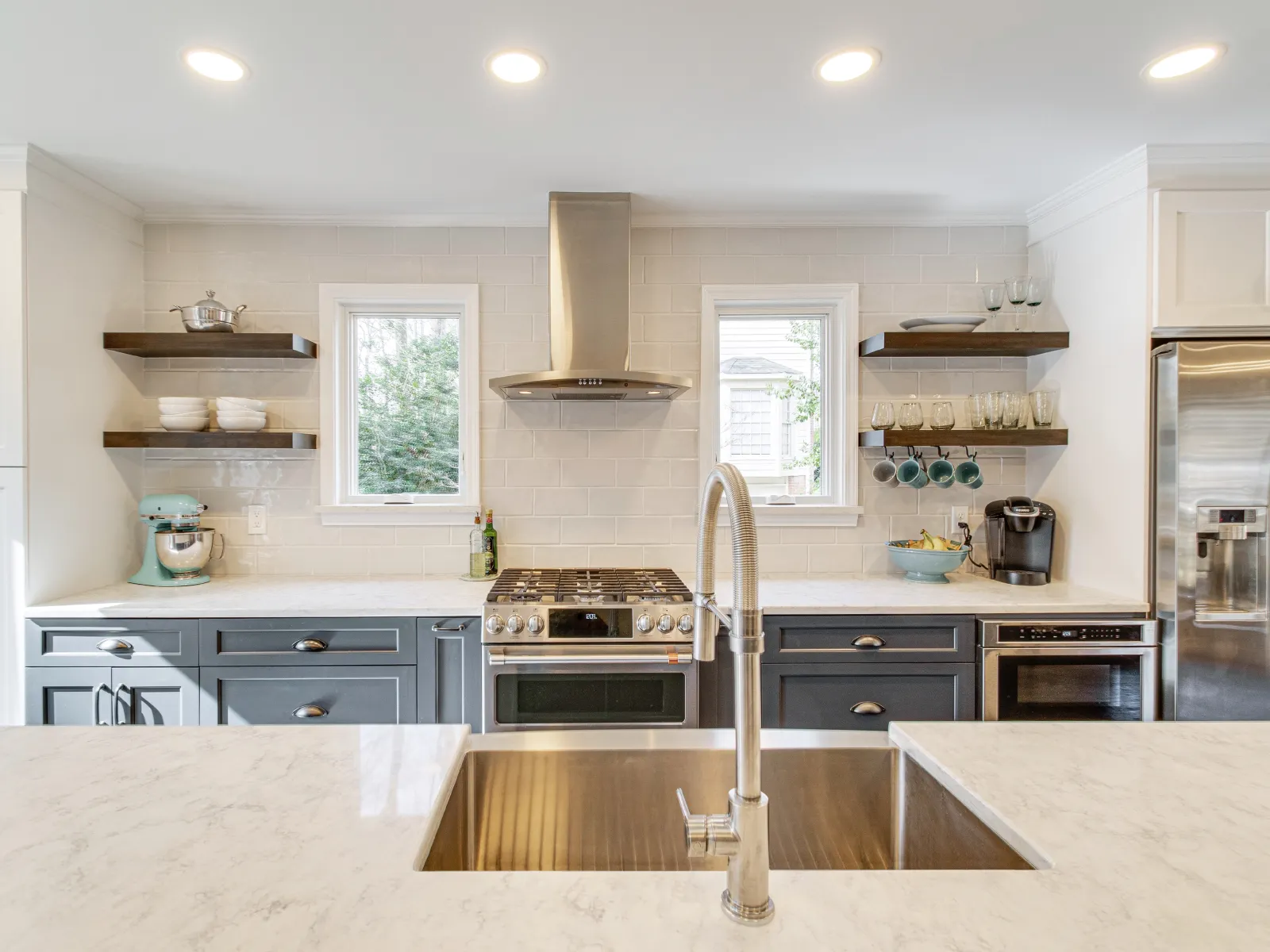 a kitchen with white cabinets