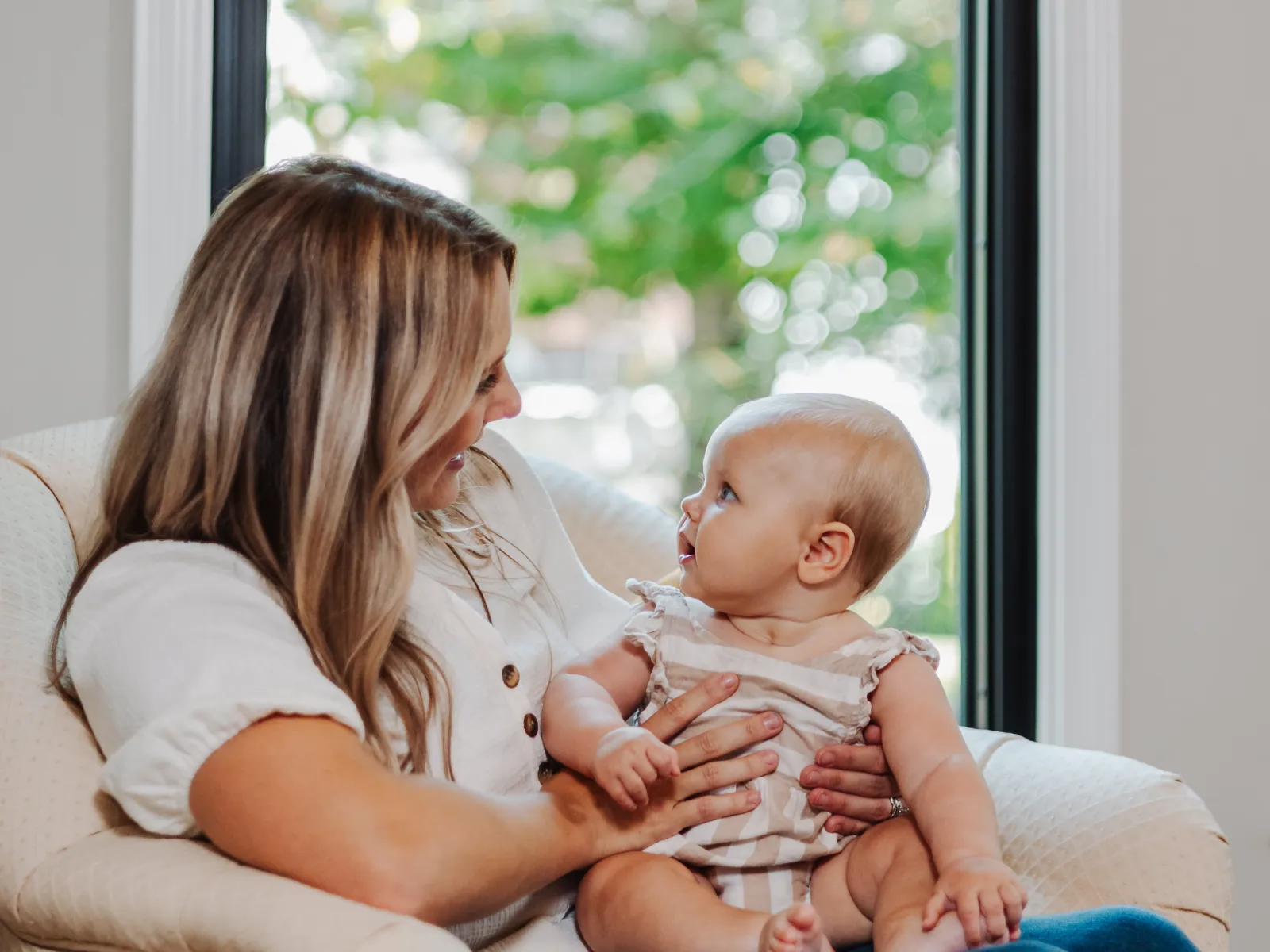 a woman holding a baby