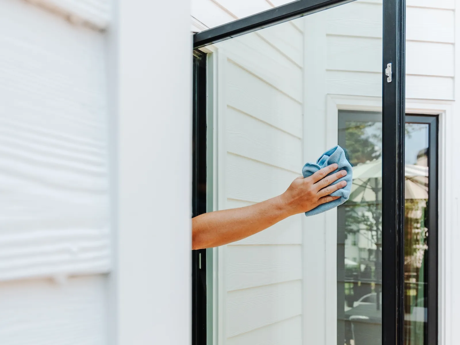 a hand holding a door frame