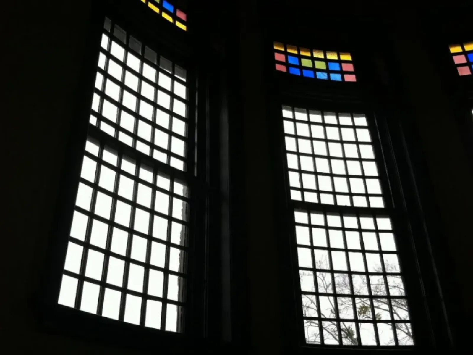 a group of windows with colorful glass