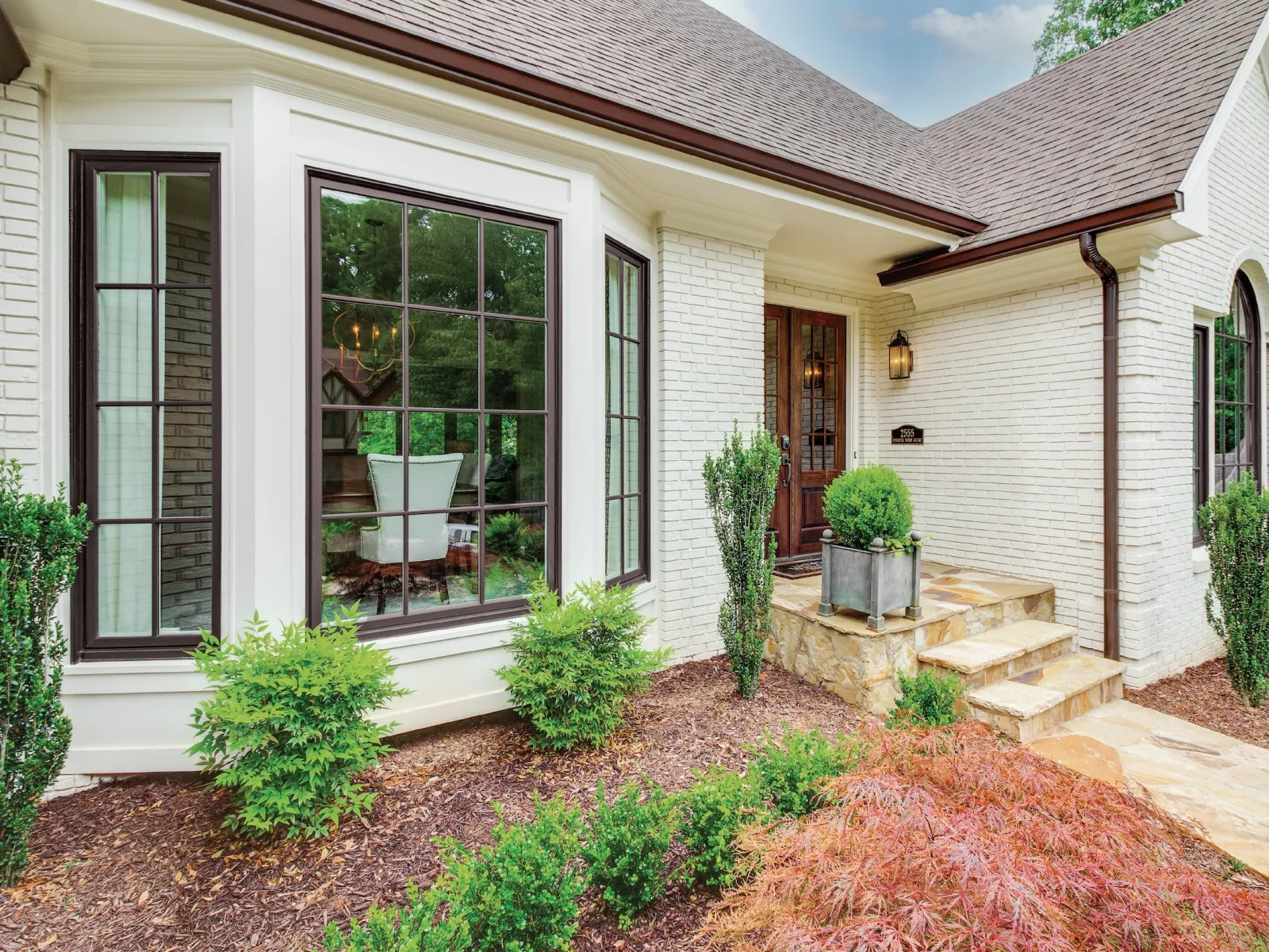 A white brick house in the Atlanta area with replacement windows from North Georgia Replacement Windows