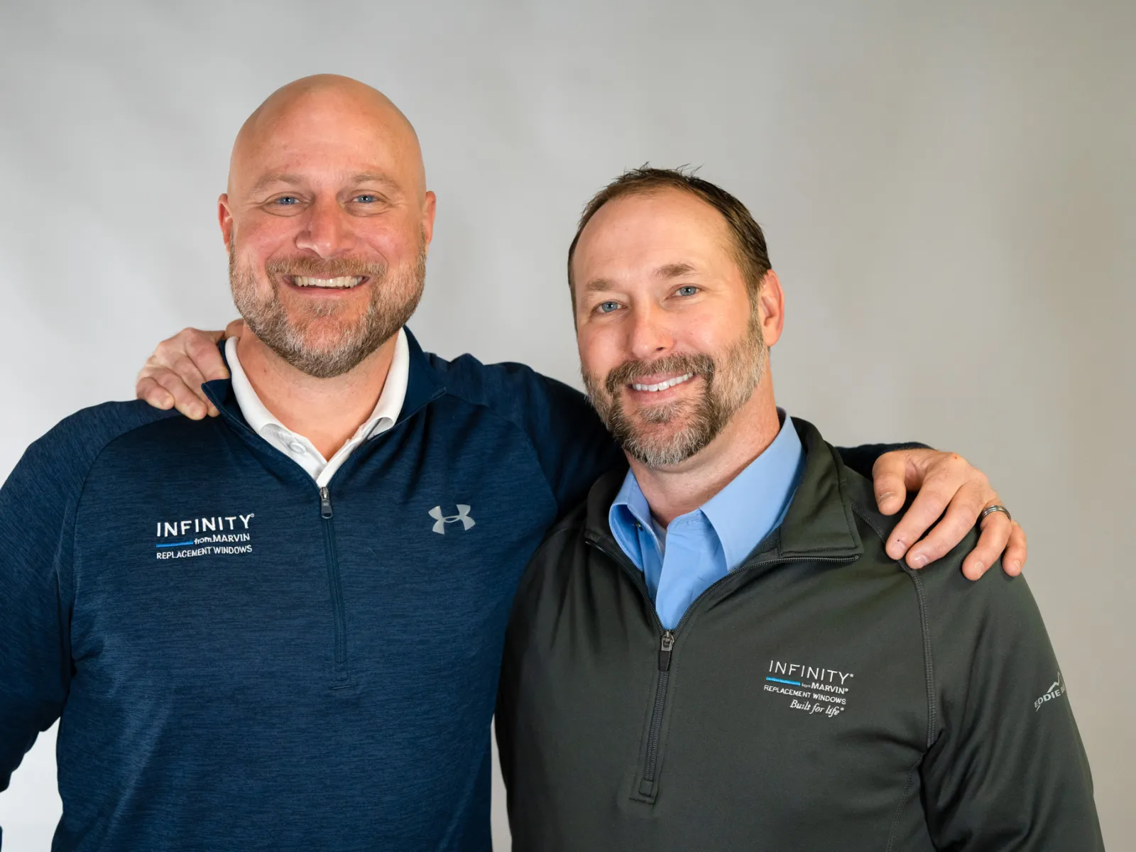 two men posing for a picture