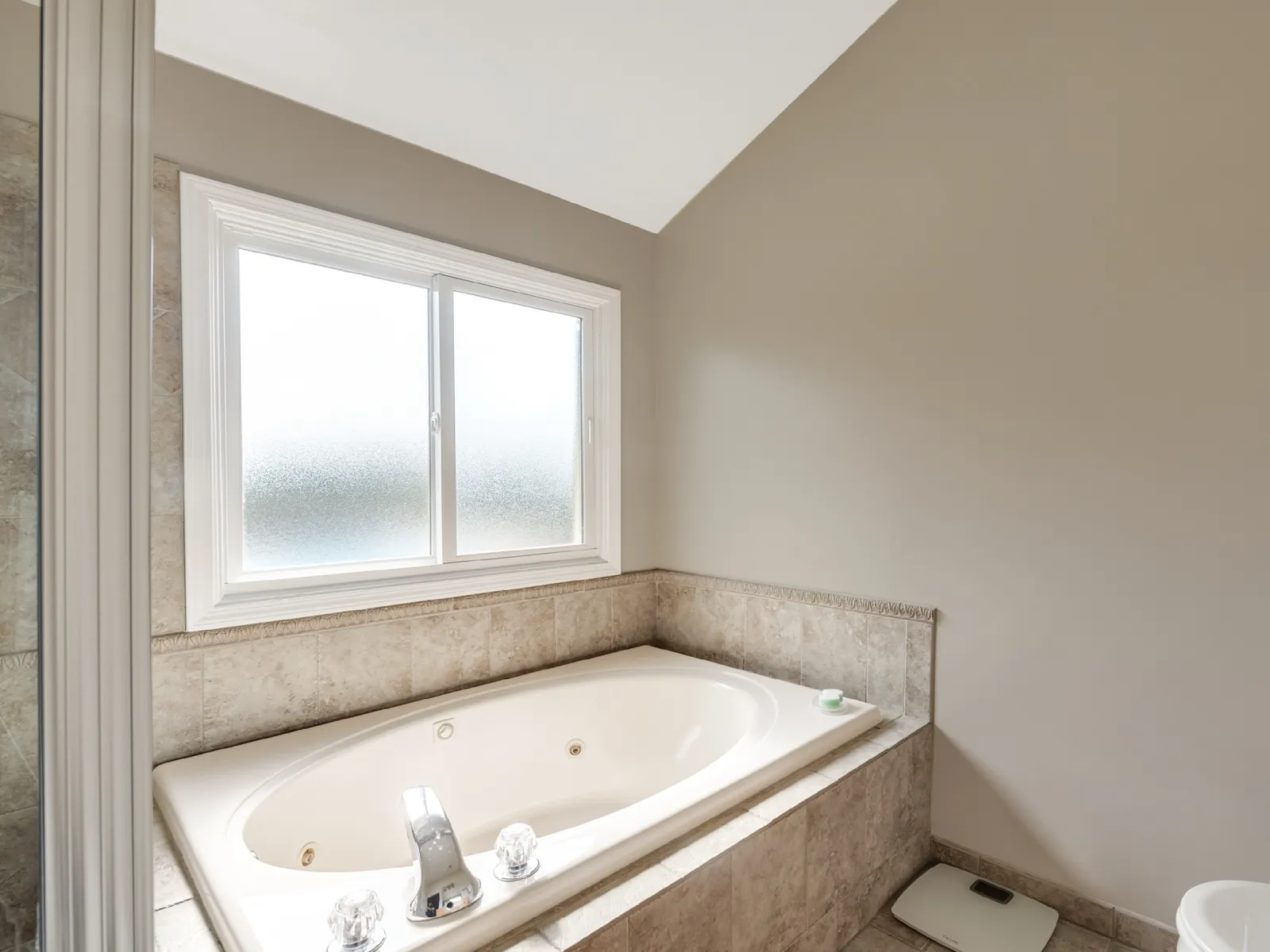 White fiberglass slider window replacement with privacy glass above bathtub