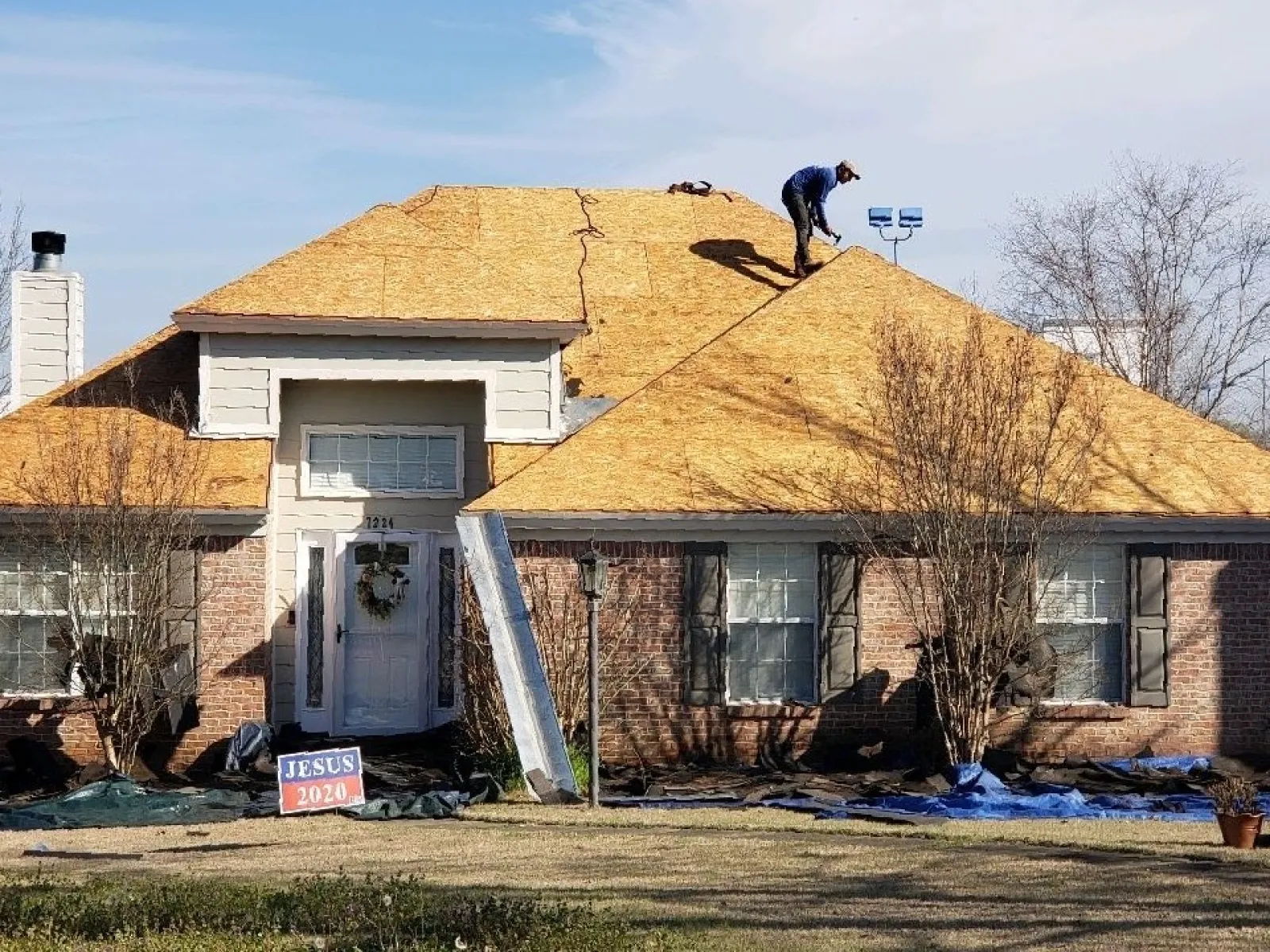 a person on a ladder on a house